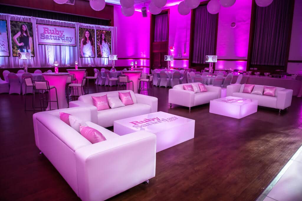 Custom Lounge Setup with LED Furniture, Logo Decals, Custom Logo Pillows and Centerpieces