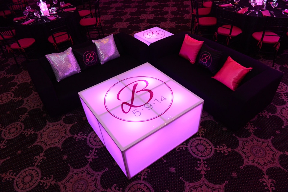 Custom Hot Pink, Black, and Silver Lounge with LED Tables, Logo Decals and Logo Pillows