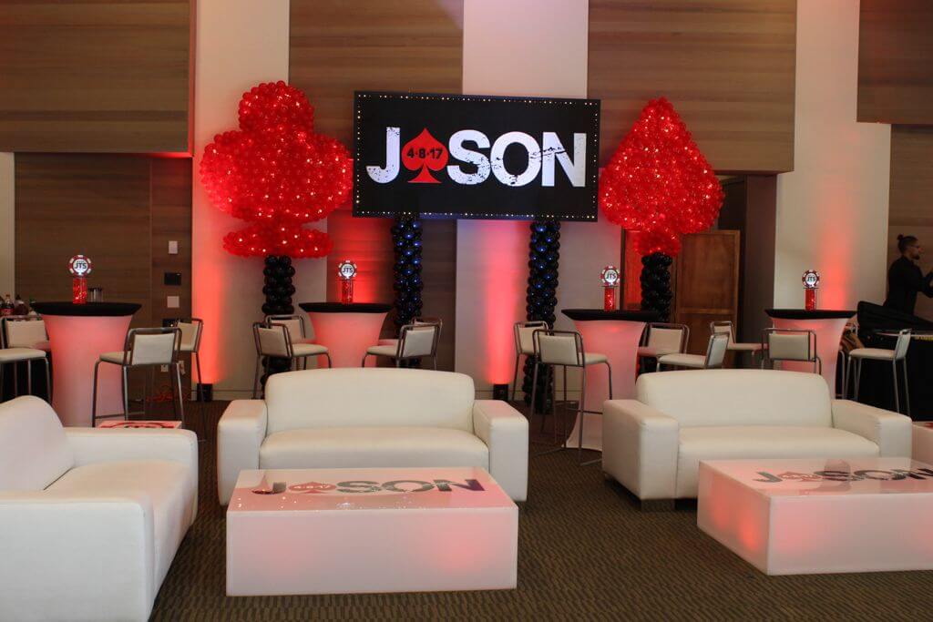 Casino Themed Bar Mitzvah Lounge with LED Furniture, Custom Logo Backdrop and Heart and Spade Balloon Sculpture at Westchester Reform Temple