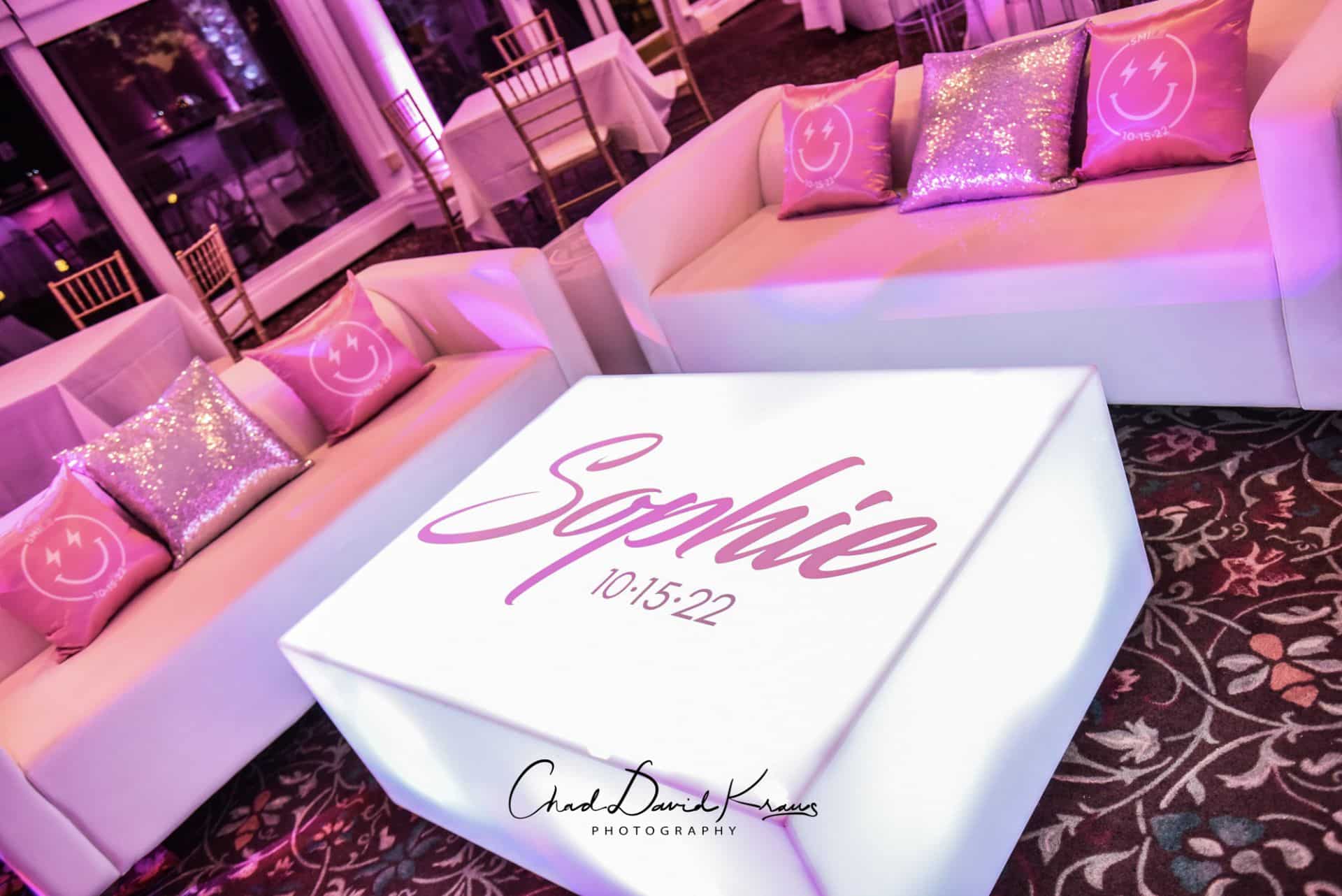 Light Pink Bat Mitzvah Lounge with Custom Coffee Tables and Logo Pillows
