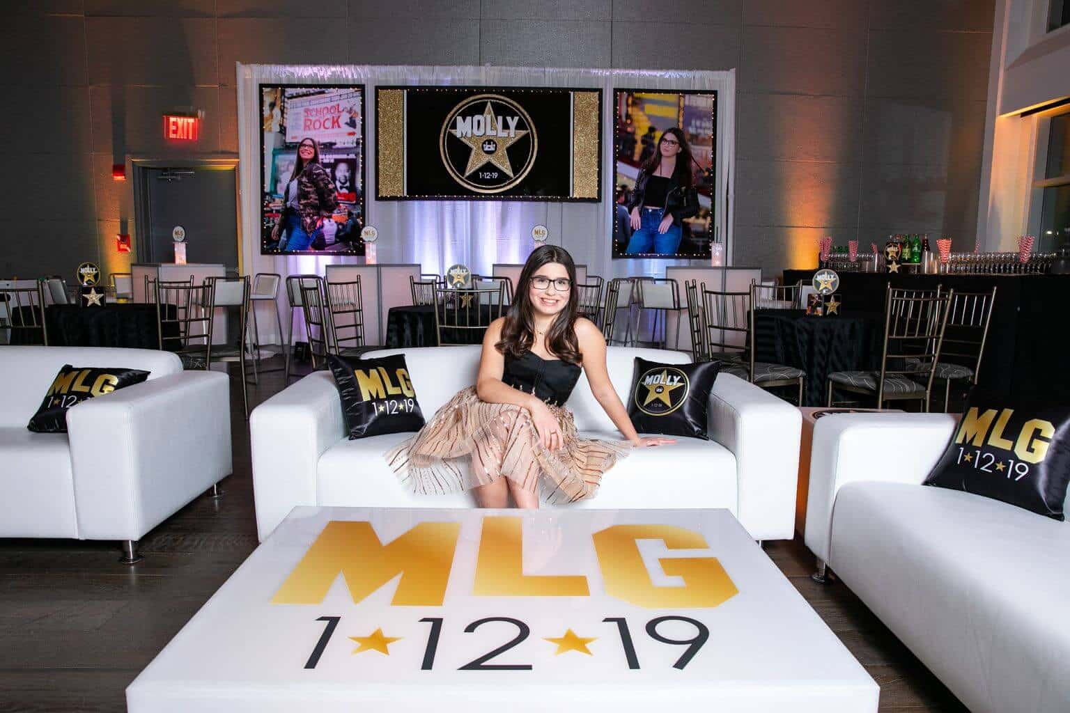 Hollywood Themed Lounge Setup with Custom Pillows and Logo Decals at Current, NYC