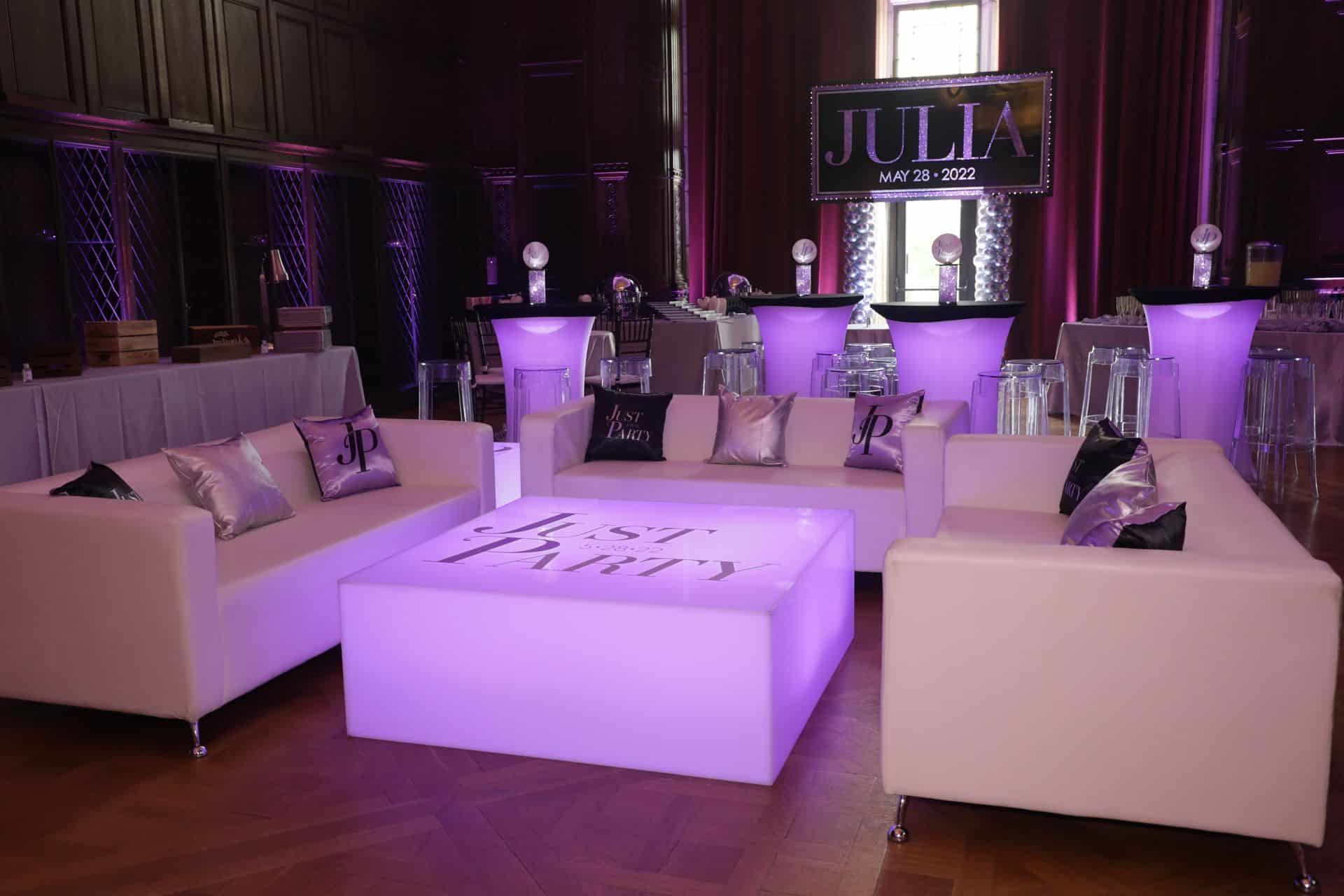 Purple Bat Mitzvah Lounge with LED Logo Tables and Glittered Backdrop at Reid Castle