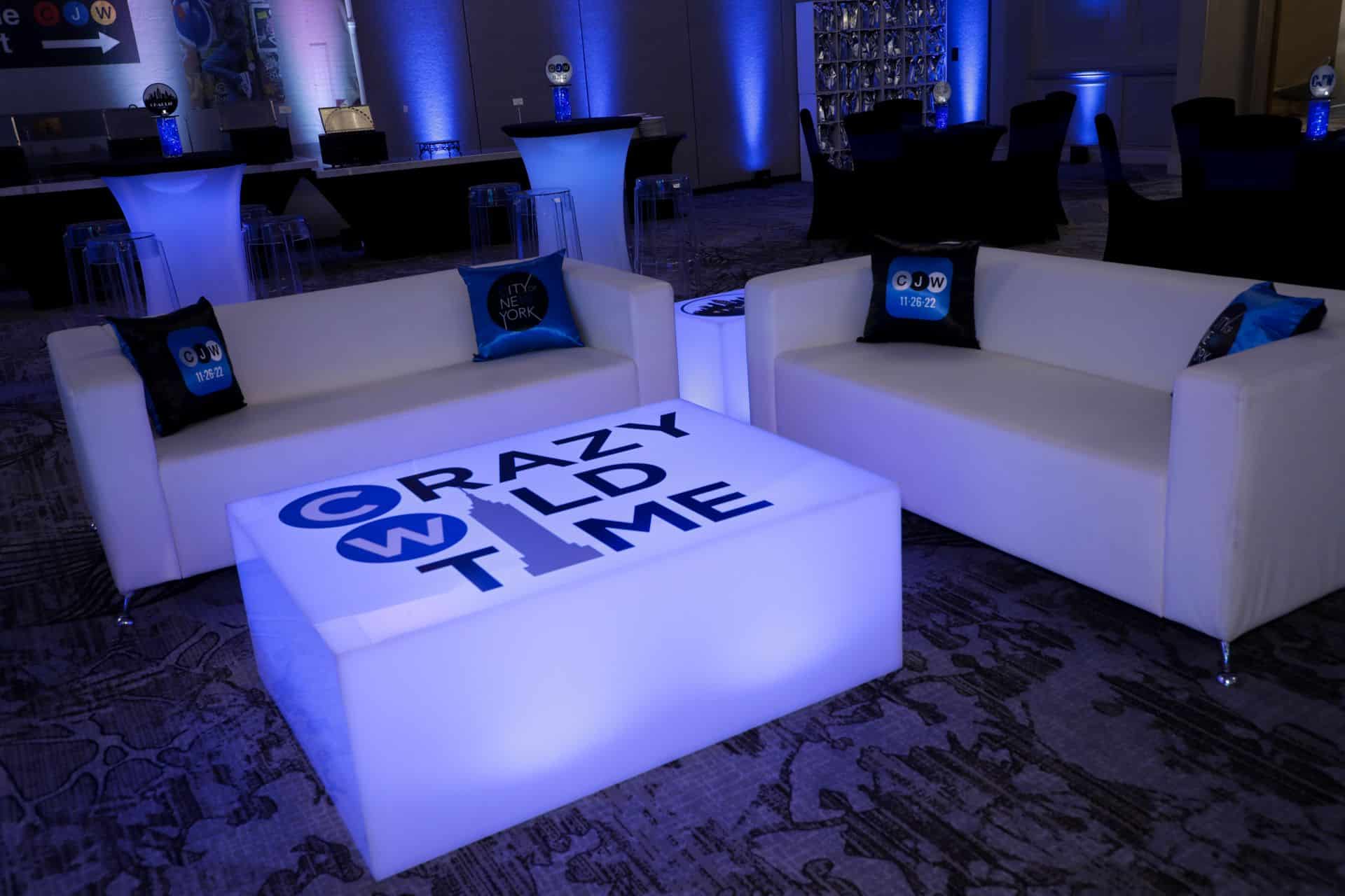 NYC Themed Bar Mitzvah Lounge with Custom Logo Tables and Pillows
