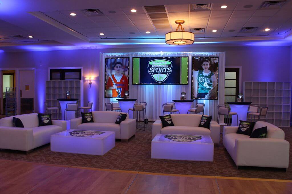 ESPN Themed Bar Mitzvah Lounge with Couches, LED High Tops, Logo Decals, Custom Pillows and Backdrop at Crestmont Country Club