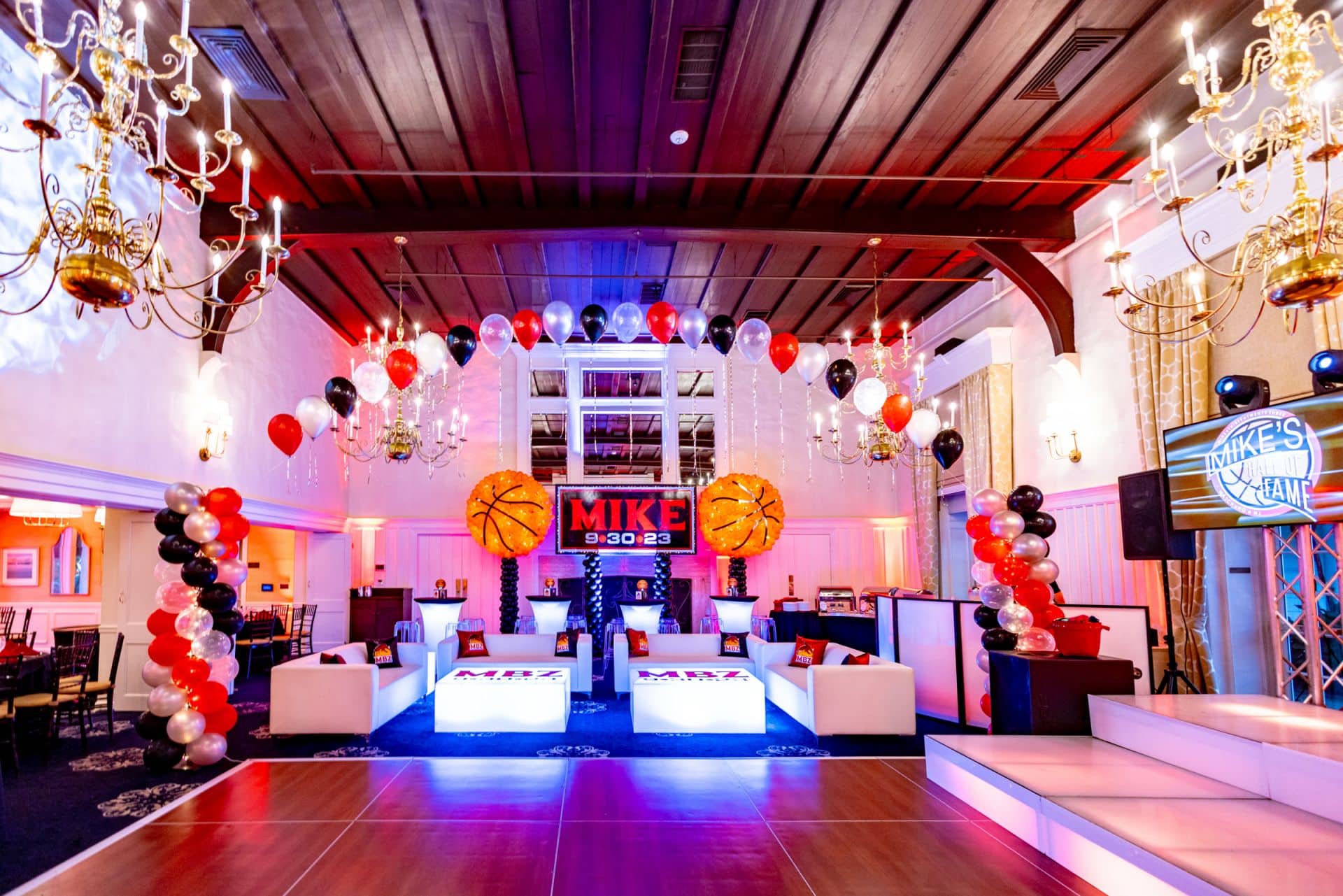 Basketball Themed Bar Mitzvah Lounge with Custom LED Tables, LED Highboys and Backdrop with Basketball Balloon Sculptures at Plainfield Country Club