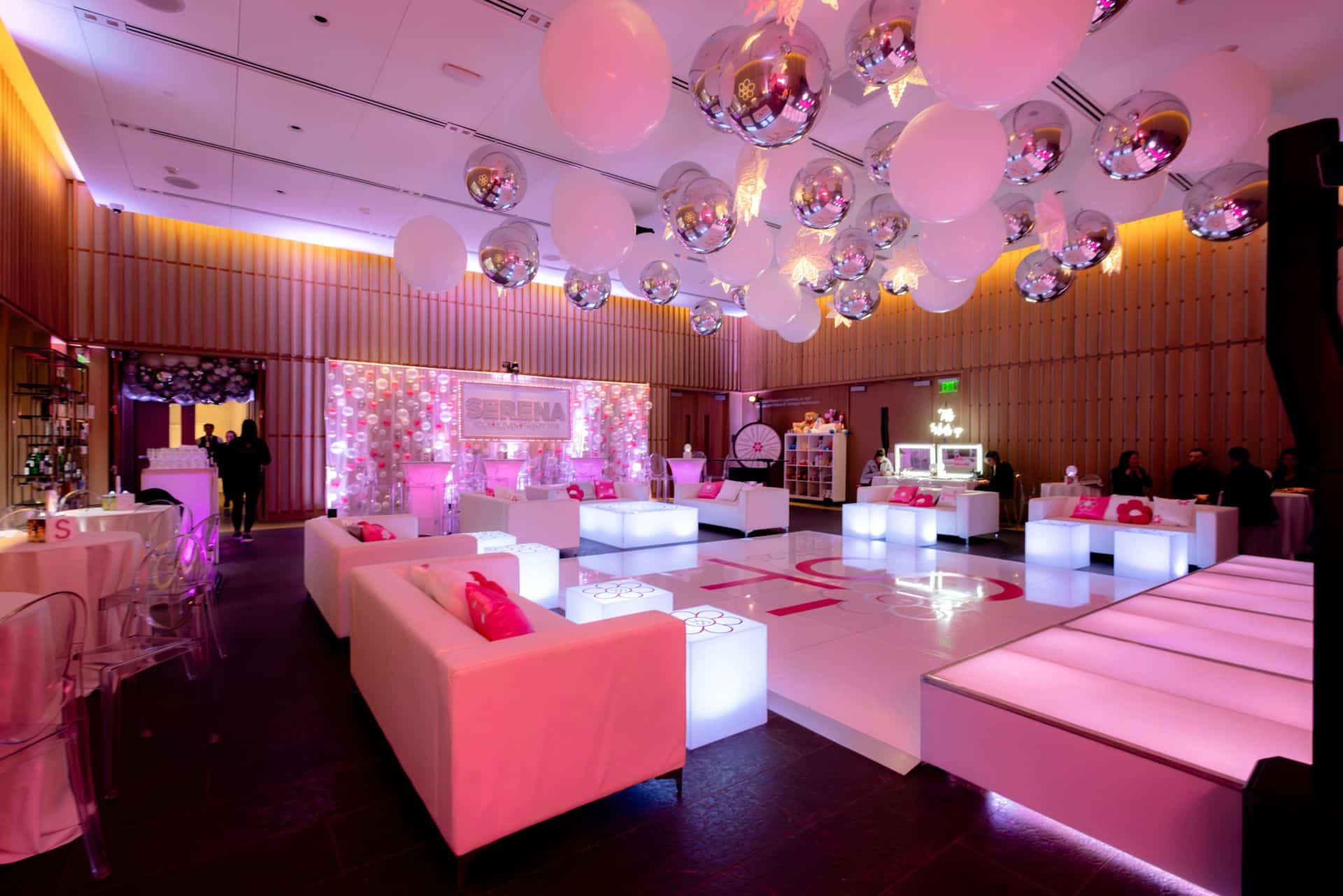 Flower Themed Bat Mitzvah Lounge with Branded Tables and Custom Pillows at The Bruce Museum