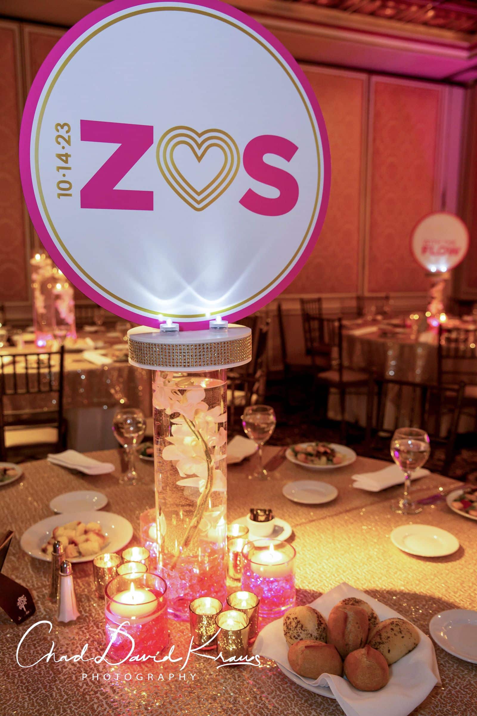 LED Logo Centerpiece with Orchids and Floating Candles