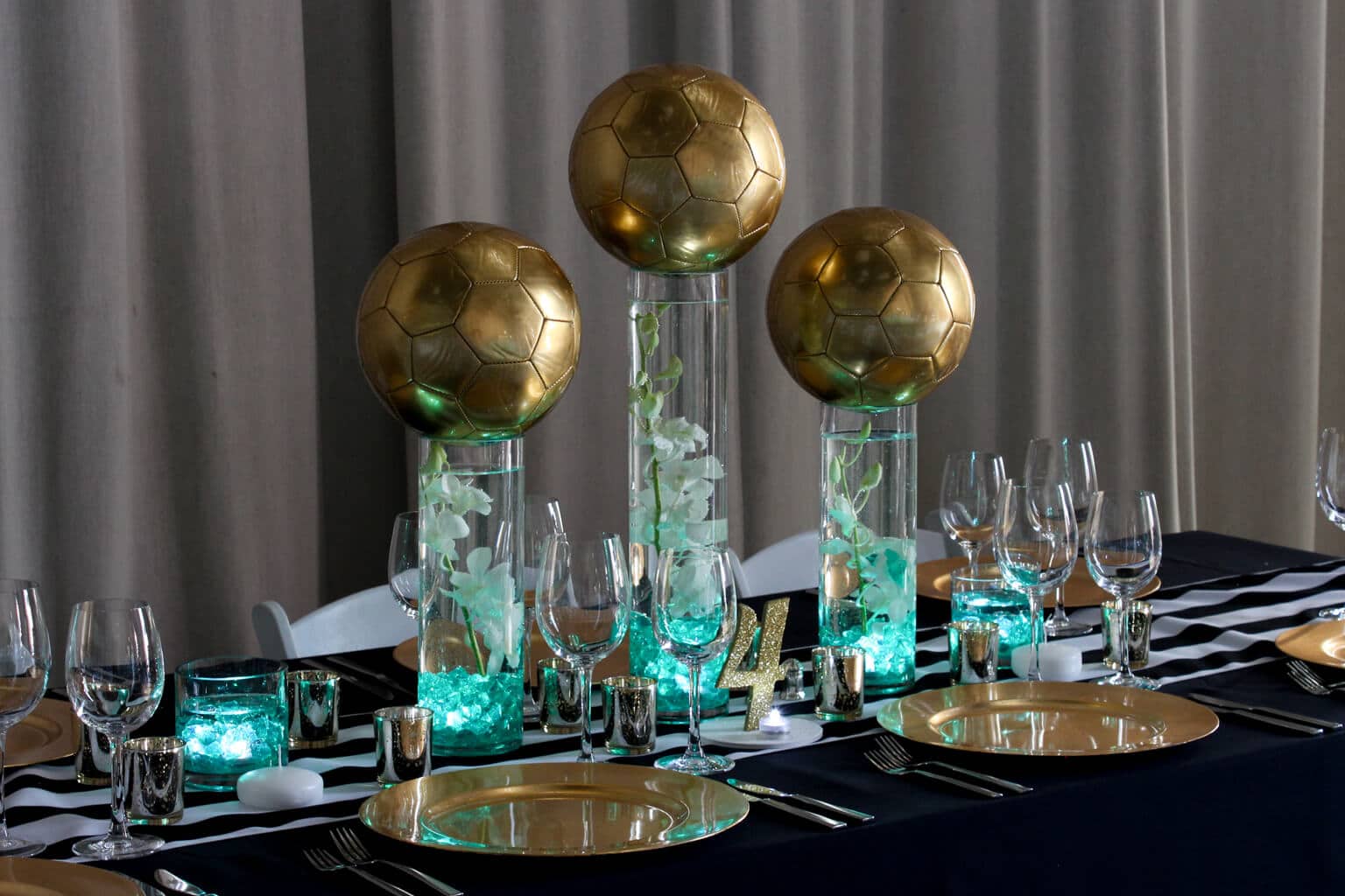 Gold Soccer Ball Centerpiece with LED Lighting, Orchids and LED Tea Lights