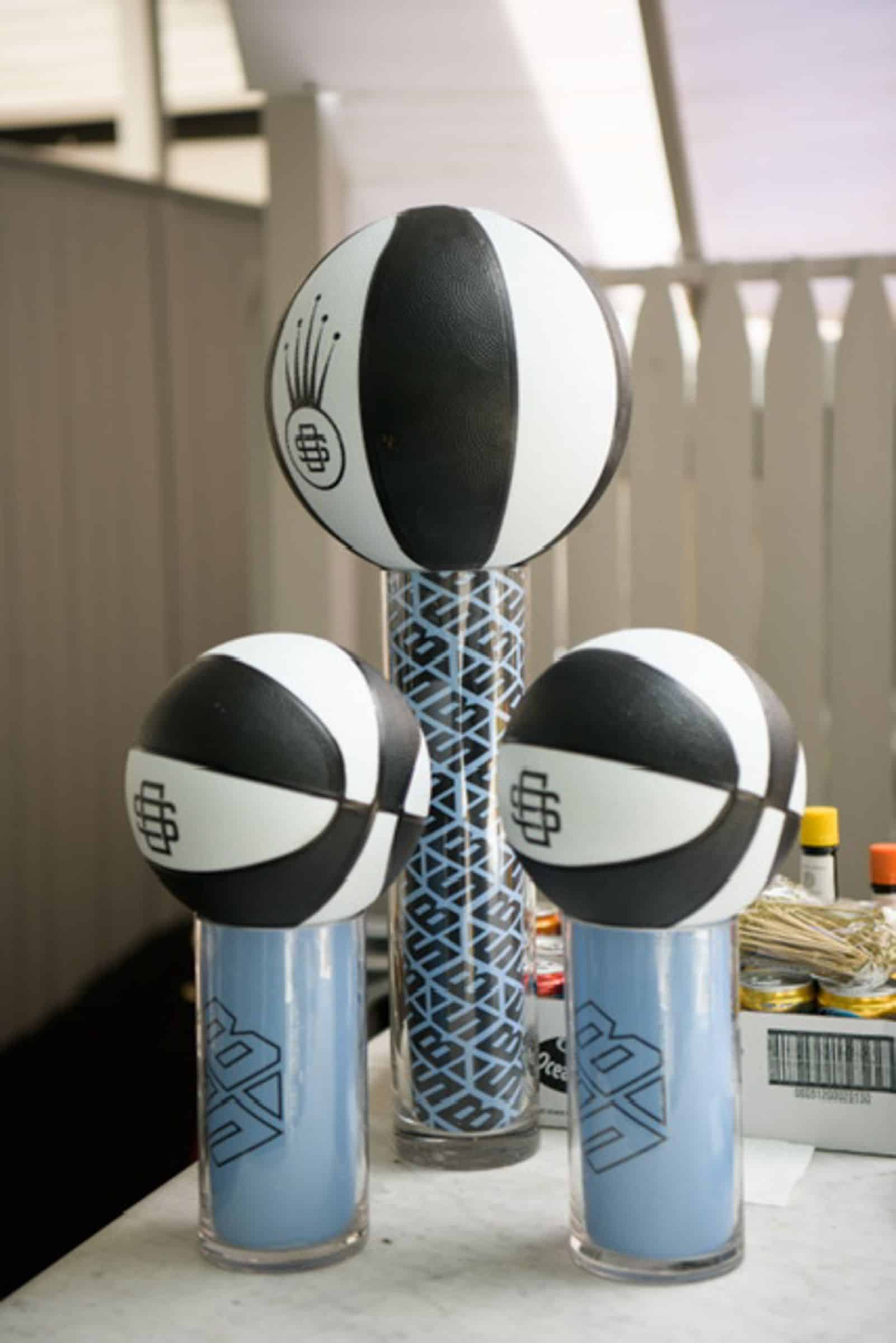 Logo Wrapped Cylinders Topped with Basketball