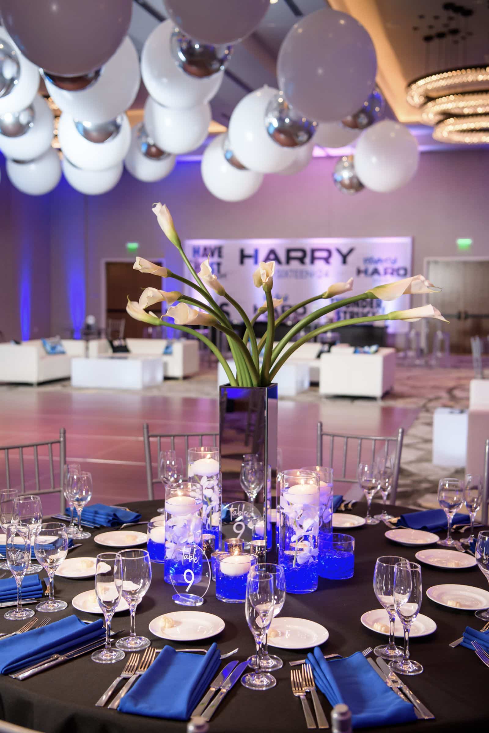 Calla Lily Centerpiece and Orchid Cylinders with LED Chips Topped with Floating Candles