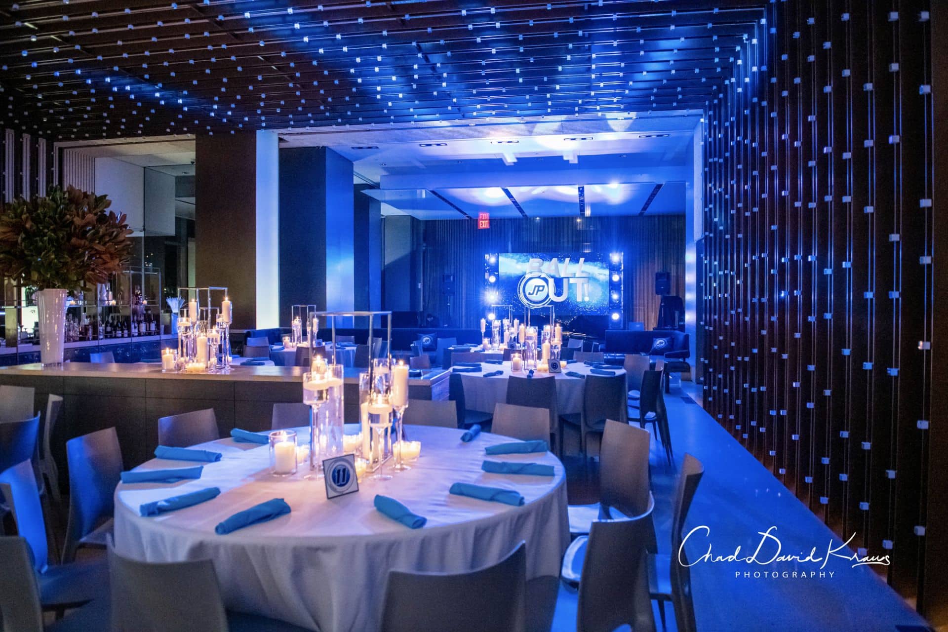 Bar Mitzvah Centerpieces with Floating Candles and Hurricane Vases at Riverpark, NYC