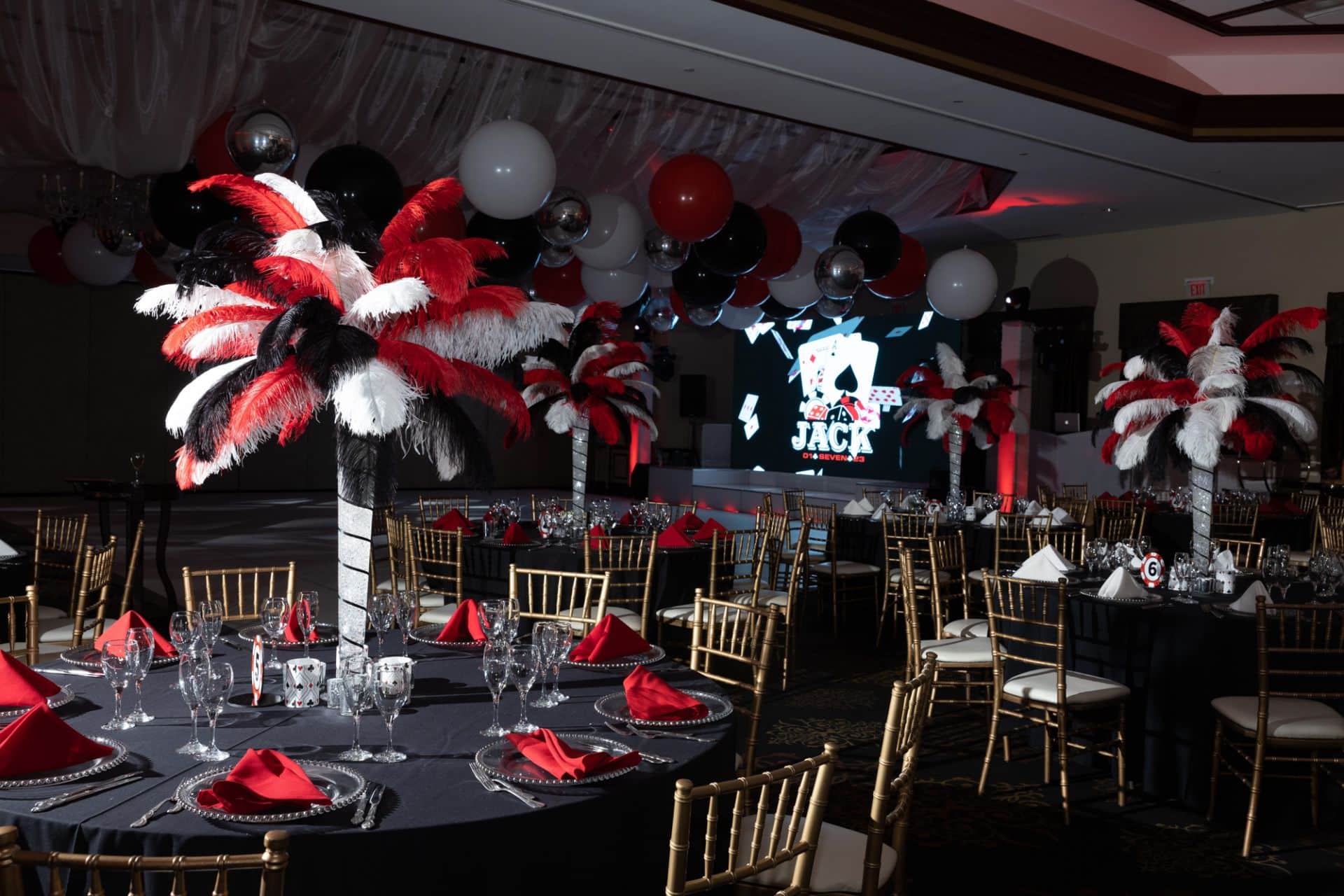 Red, Black and White Feather Centerpieces with Custom Votives for Casino Themed Bar Mitzvah at Temple Emanu-el, Closter, NJ