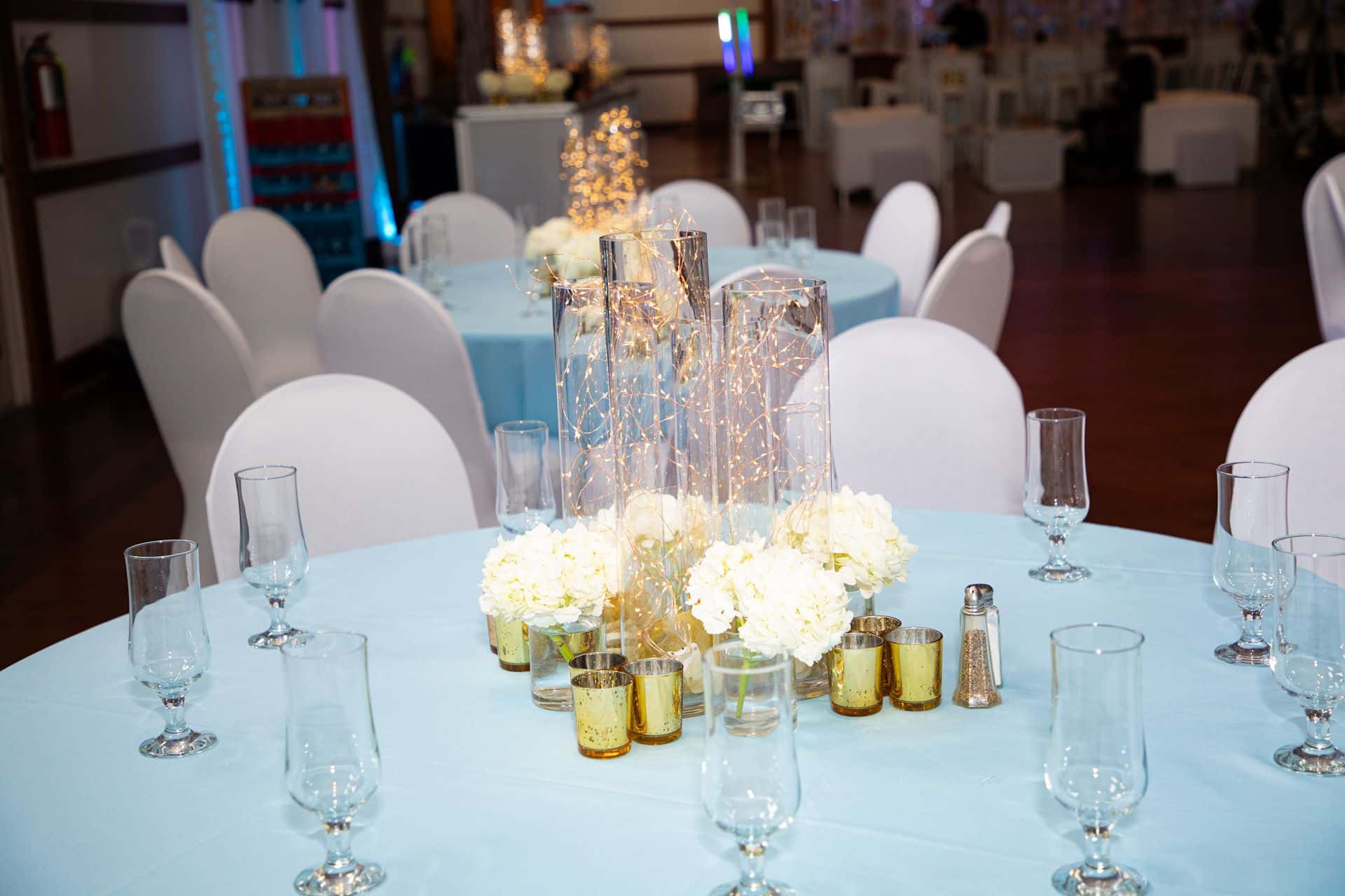 Fairy Light Centerpiece with Hydrangeas and Gold Votives
