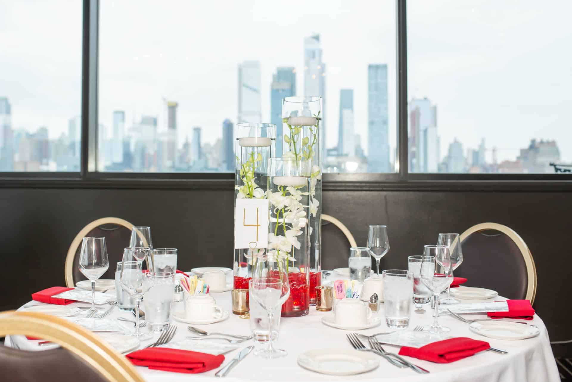 Orchid Centerpiece Cylinders with Red Chips and Floating Candles