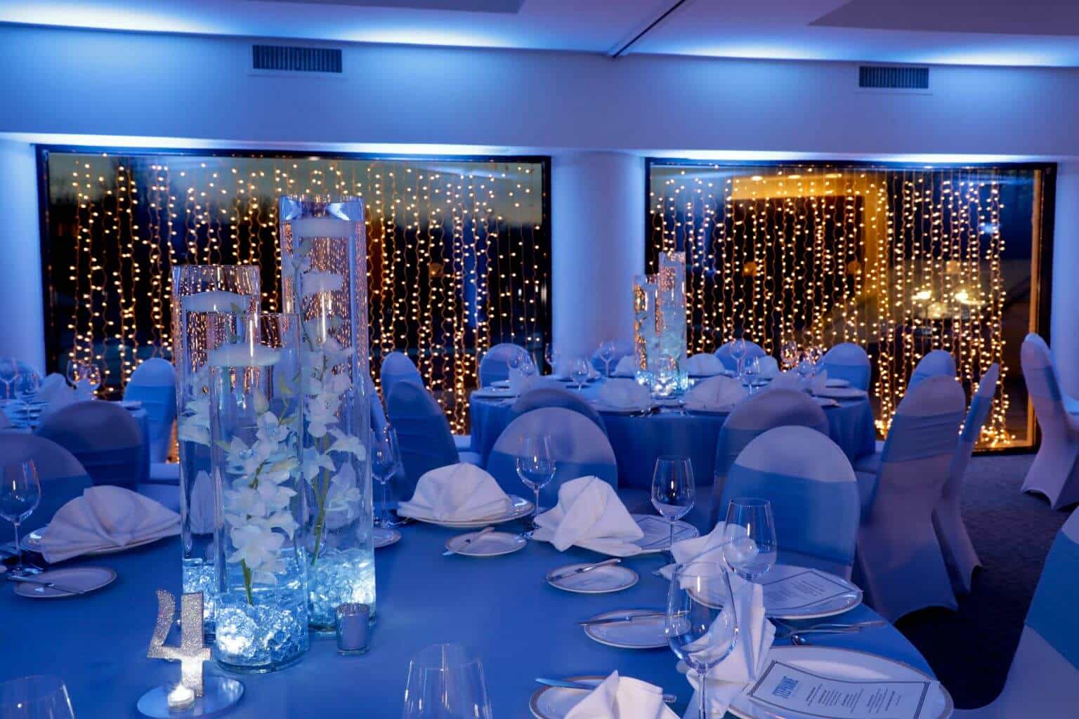 Pale Blue Orchid Centerpiece with Floating Candles and Custom Table Numbers