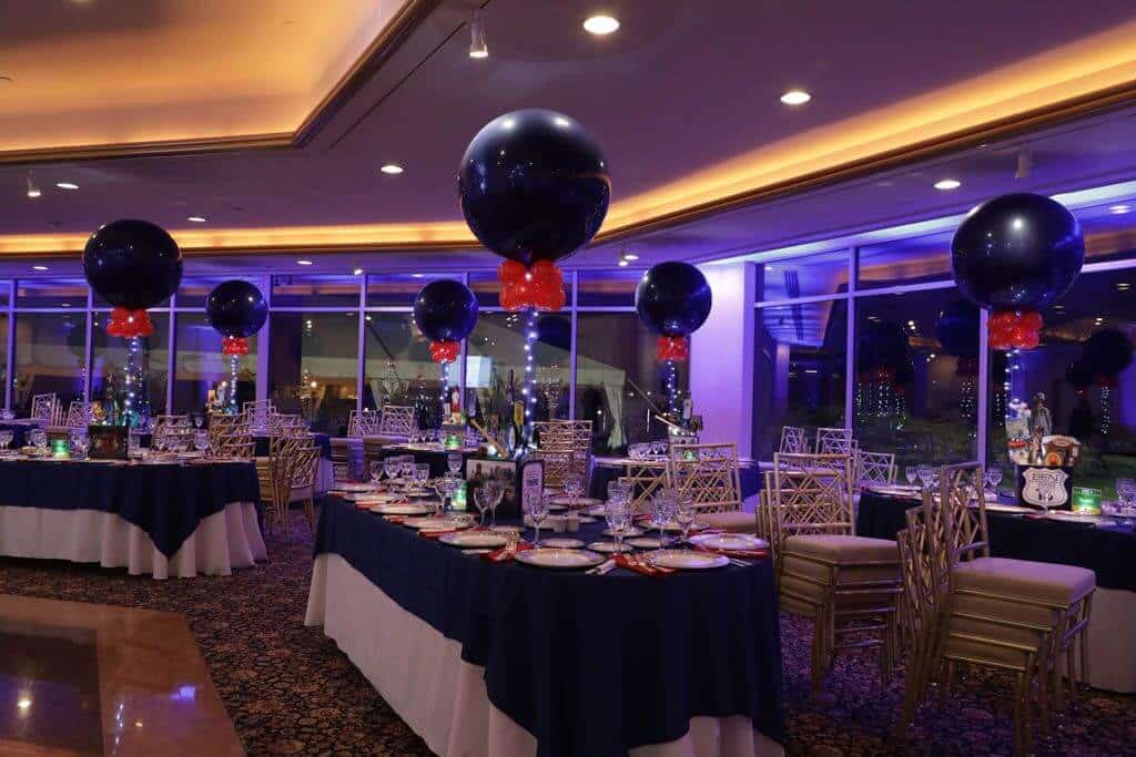 Travel Themed Bar Mitzvah with Navy and Red Balloon Centerpieces and Blue Uplighting at Glen Island Harbour Club, NY