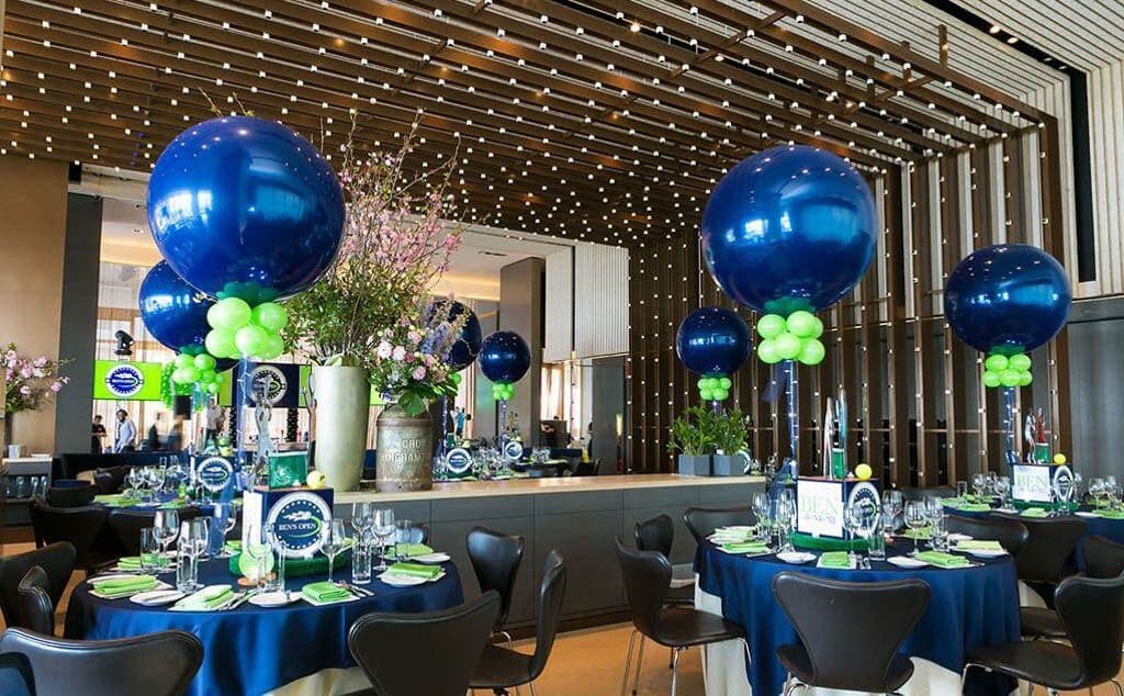 Tennis Themed Bar Mitzvah with Sports Cube Centerpieces and Navy and Lime Balloons at Riverpark, NYC