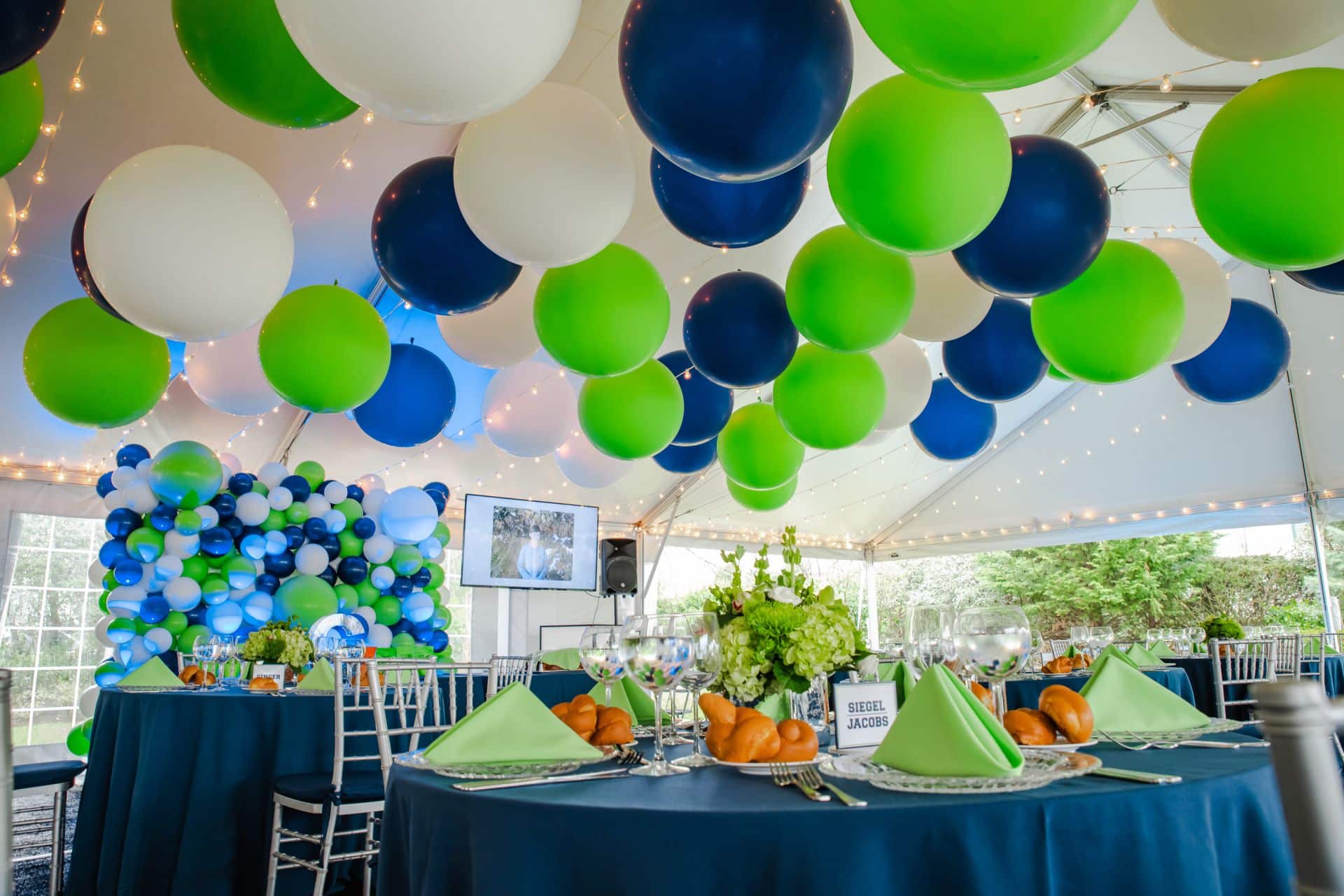 Beautiful Bar Mitzvah Tent Party with 3' Balloon Ceiling Treatment and Organic Balloon Wall For Backyard Party Decor