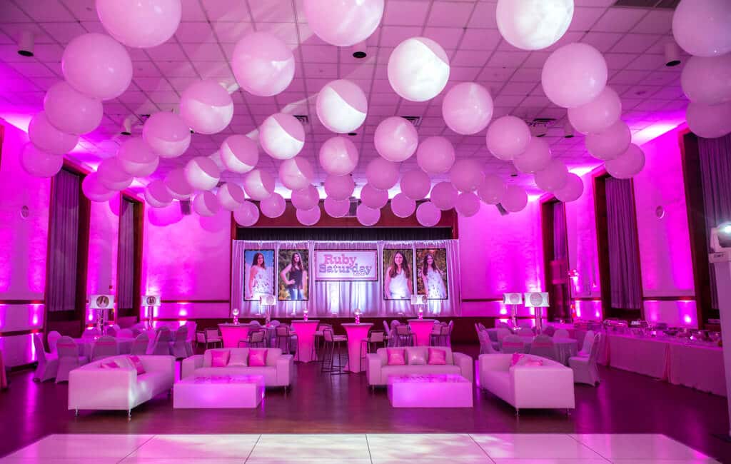 Club Themed Bat Mitzvah with White Balloons on Ceiling, Custom Lounge, Hot Pink Up-Lighting and Logo Backdrop at Temple Israel Center