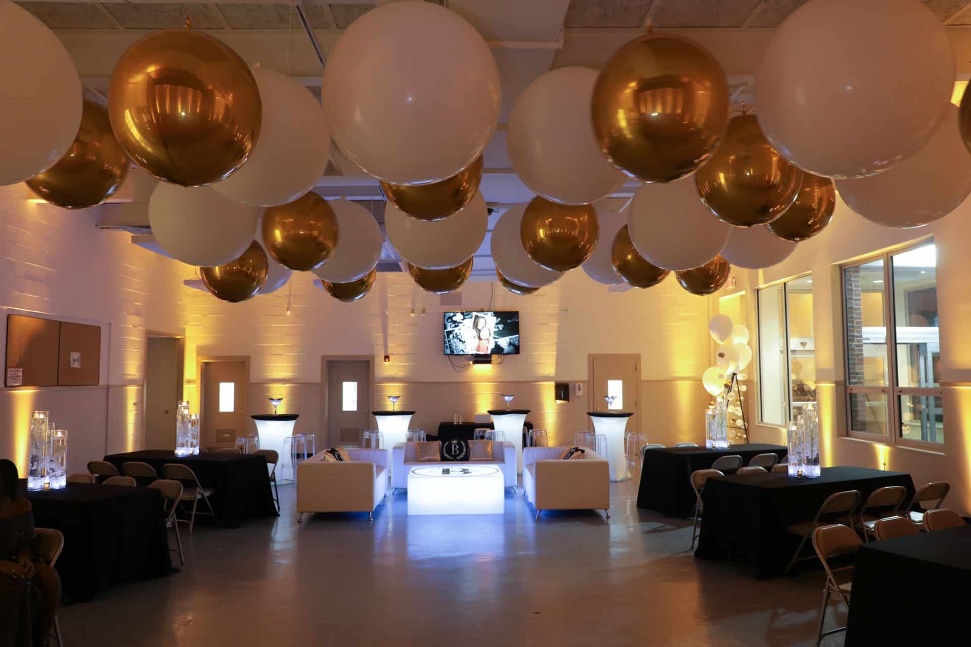 Gold and White Quinceanera with White and Gold Ceiling Balloons, Custom LED Lounge and Gold Uplighting