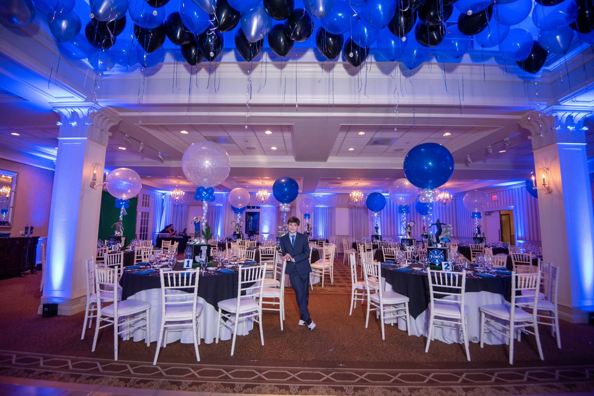 Sports Themed Bar Mitzvah with Loose Ceiling Balloons, Custom Centerpieces and LED Balloons at Preakness Hills CC