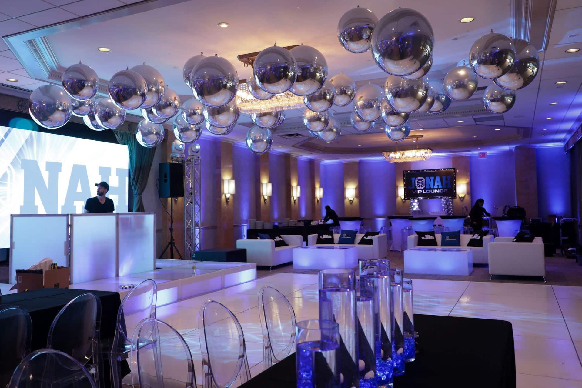 Blue & Silver Bar Mitzvah Setup with Metallic Orbz Ceiling Treatment, Blue Uplighting and Custom LED Lounge at Woodcliff Lake Hilton