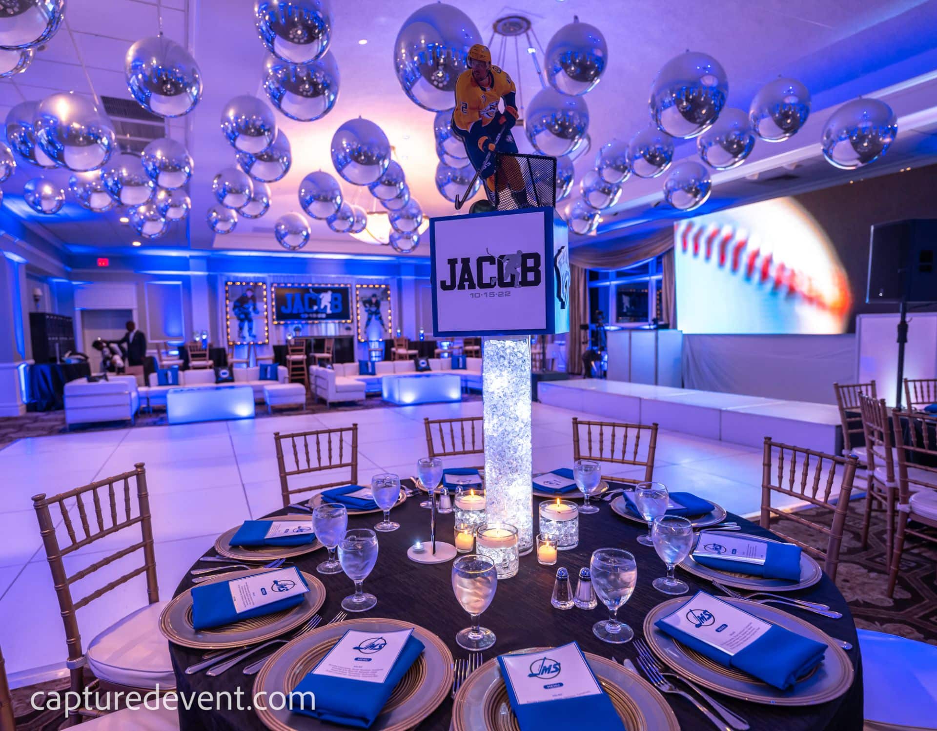 Hockey Themed Bar Mitzvah with Metallic Orbz. Ceiling Treatment and Custom Sports Centerpieces at Cedar Hill Country Club