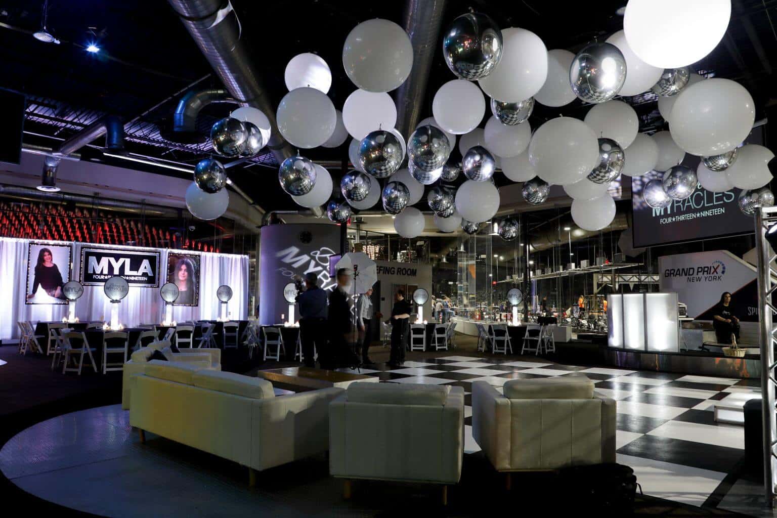 White and Silver Ceiling Balloon Treatment over Dance Floor at Grand Prix, Mt. Cisco
