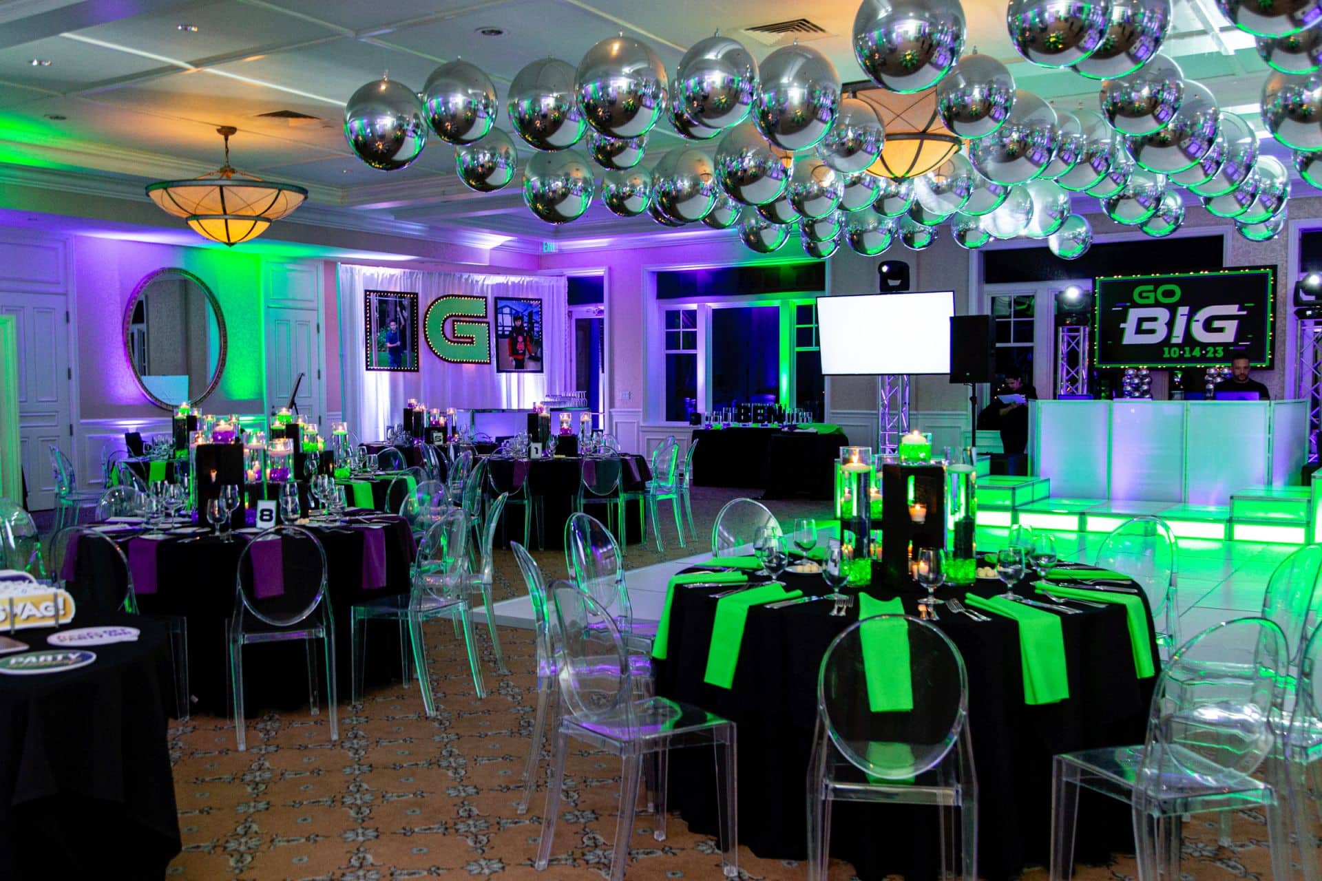 Neon Themed Bar Mitzvah with Silver Balloons over Dance Floor, LED Cinder Block Centerpieces, Blowup Photo and Initial Behind Bar and LED Uplighting at Tamarack Country Club