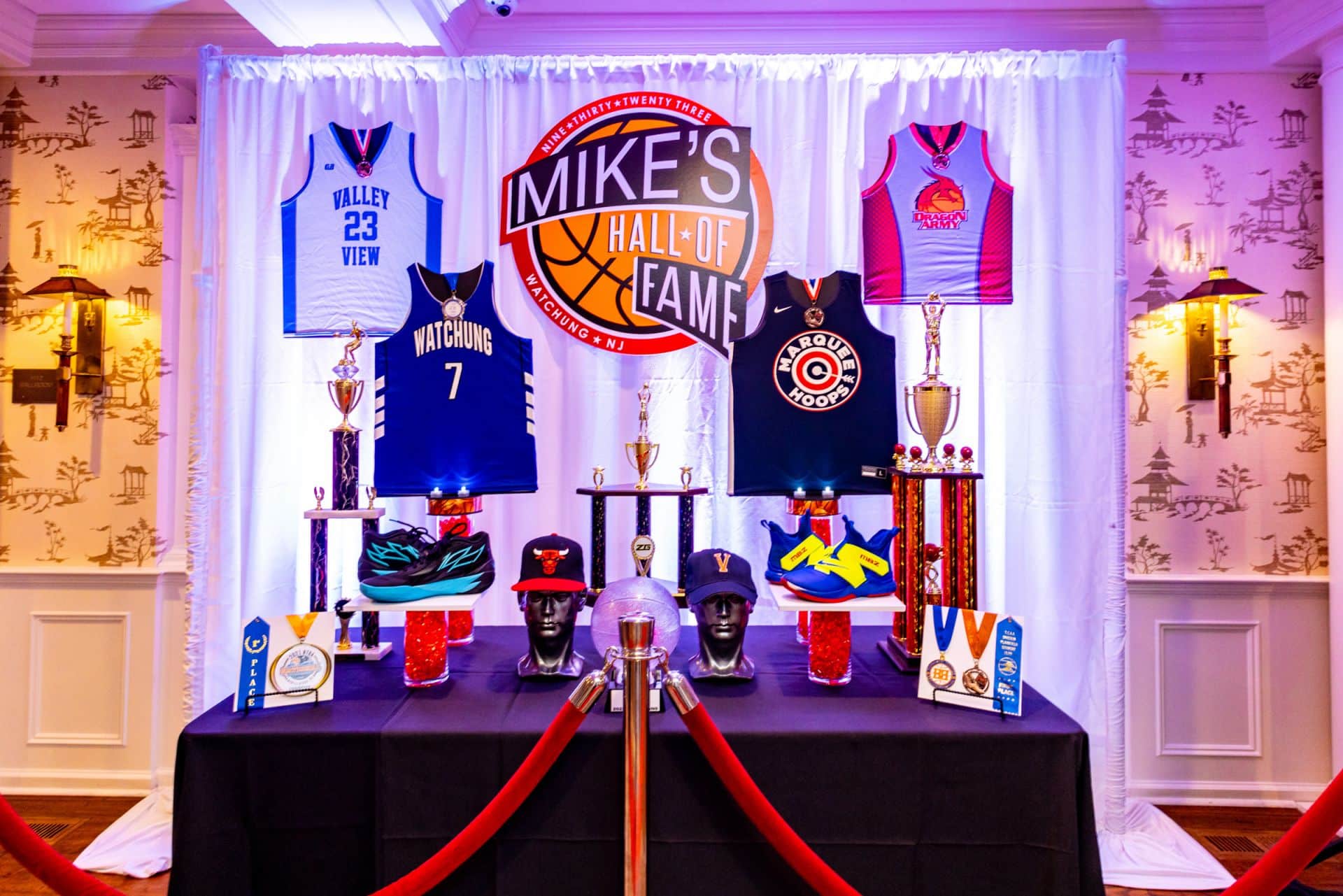 Custom Hall of Fame Display with Logo Sign, Jerseys and Trophies for Basketball Themed Bar Mitzvah
