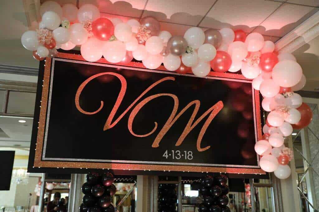 Organic Balloon Sculpture Garland on Custom Sweet 16 Backdrop