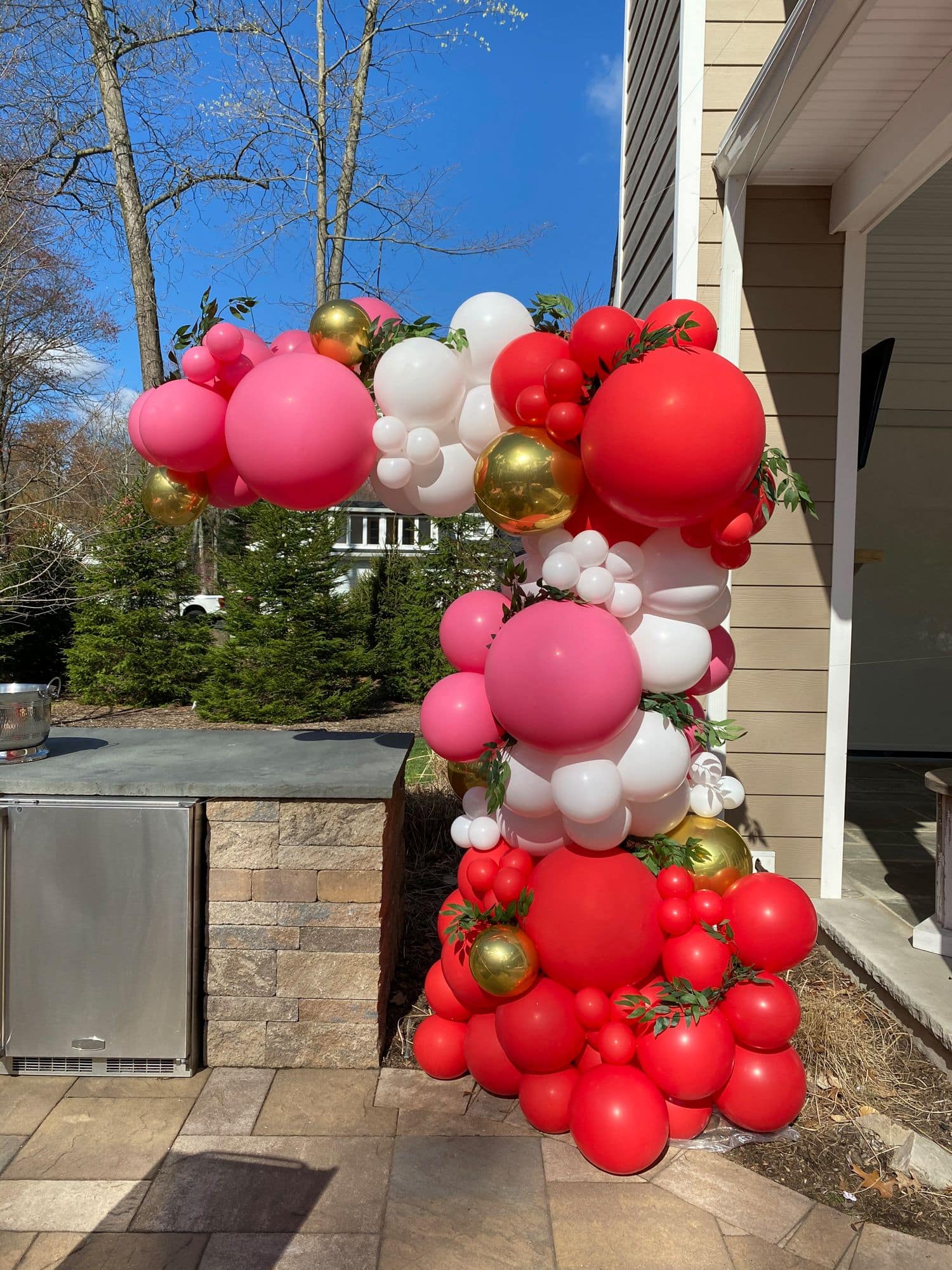Organic Half Arch With Greenery Accent for Outdoor Engagement Party