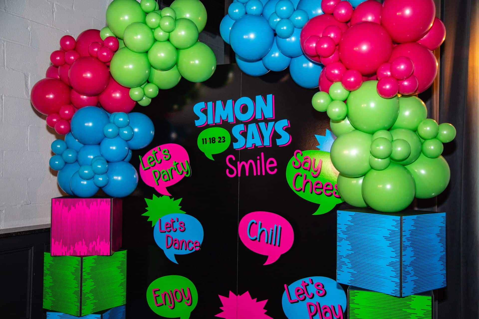 Custom Neon Photo Booth Backdrop with Organic Neon Balloon Garland