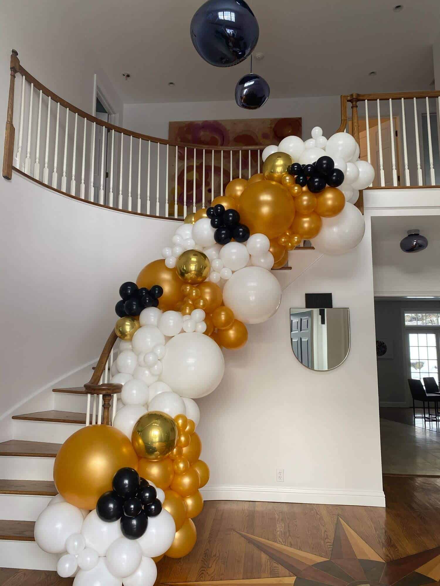 Organic Balloon Garland Over Stairway for House Party Decor