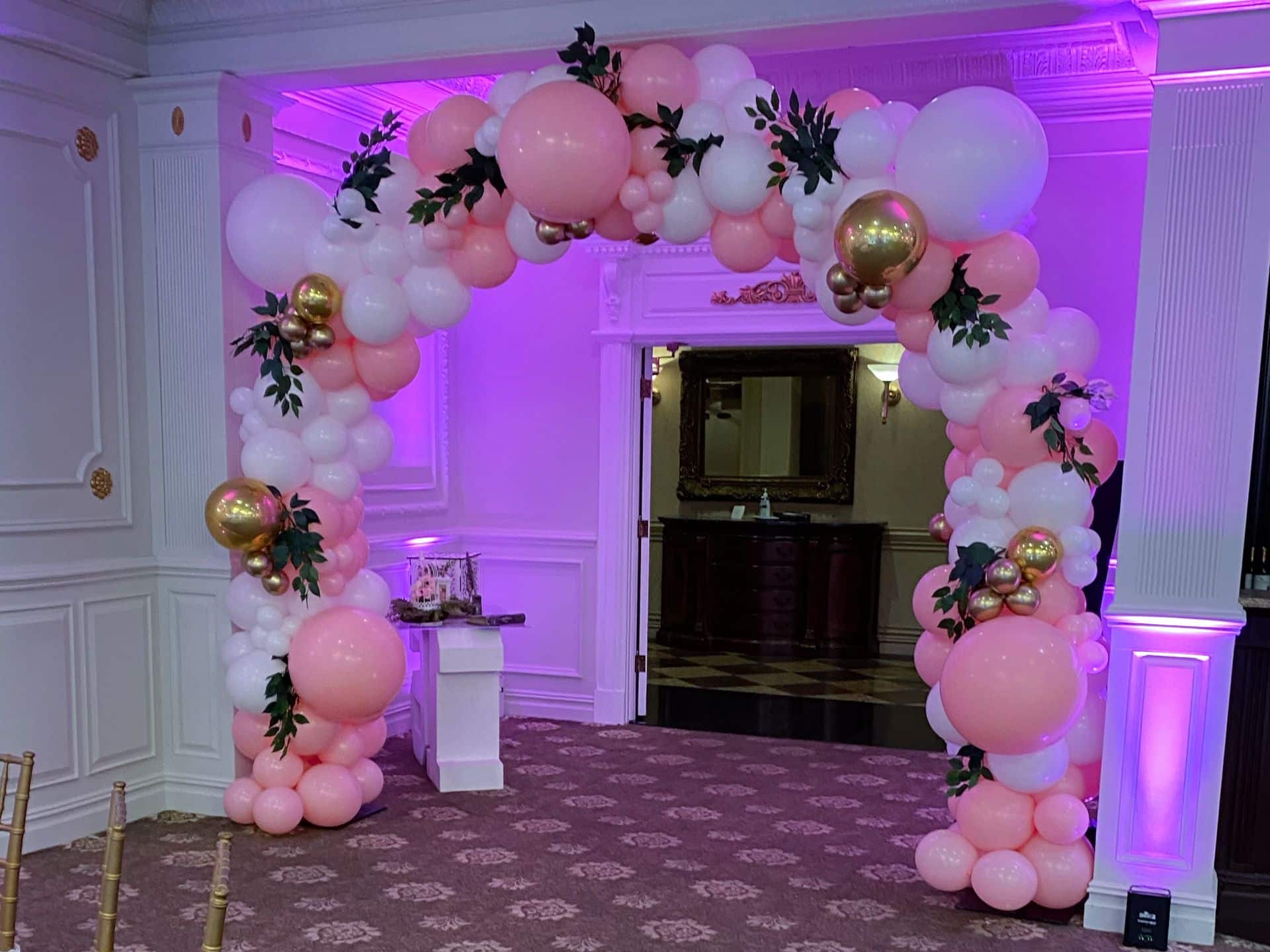 Pink, White and Gold Organic Balloon Arch over Entrance to Sweet Sixteen