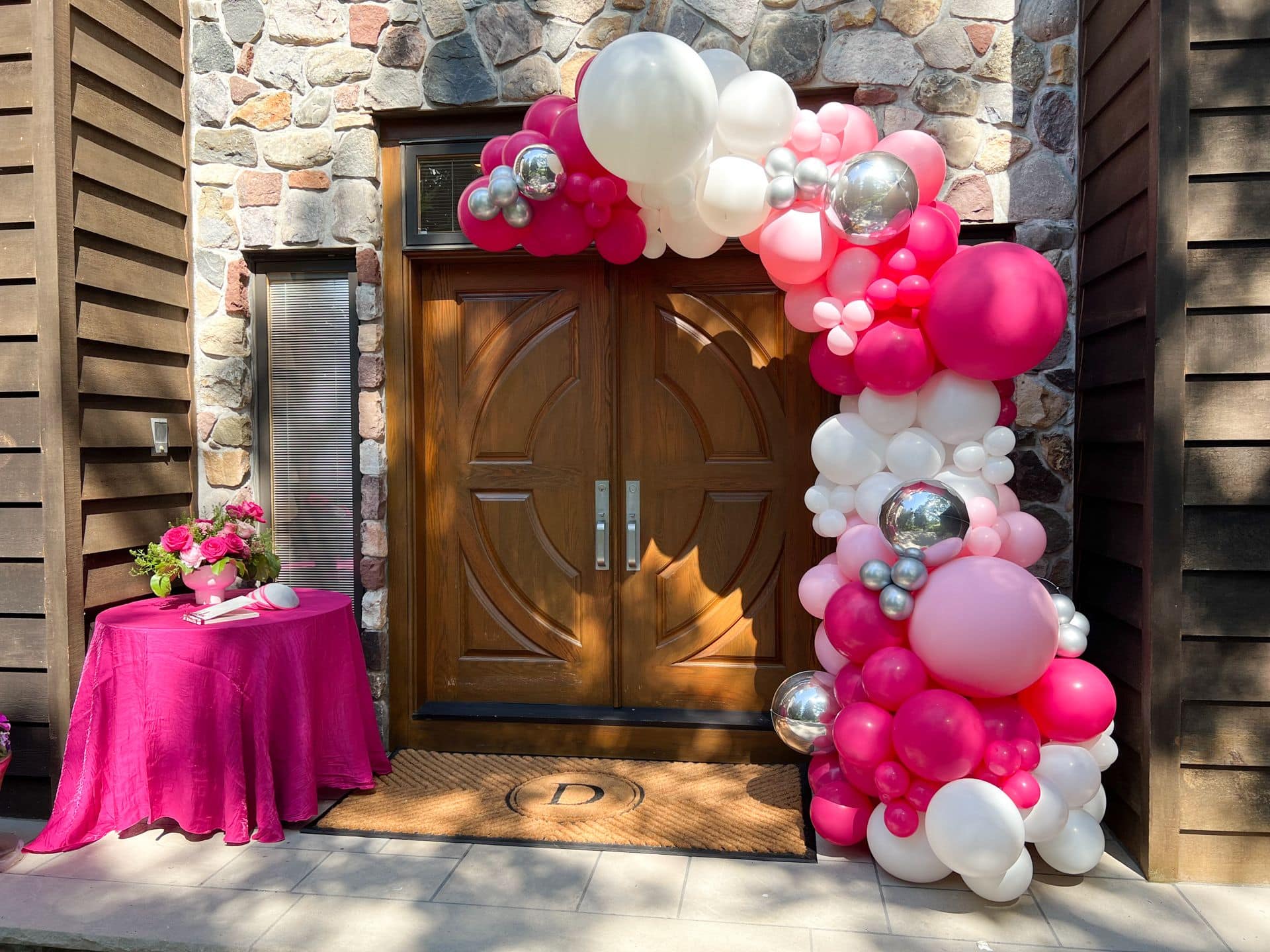 Pink, White and Silver Garland over Entrance to Home for Bat Mitzvah