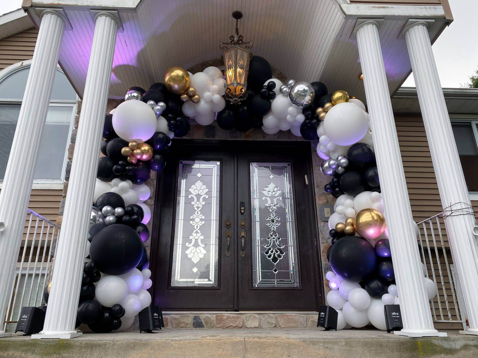 Black and White Organic Balloon Garland over House Entrance