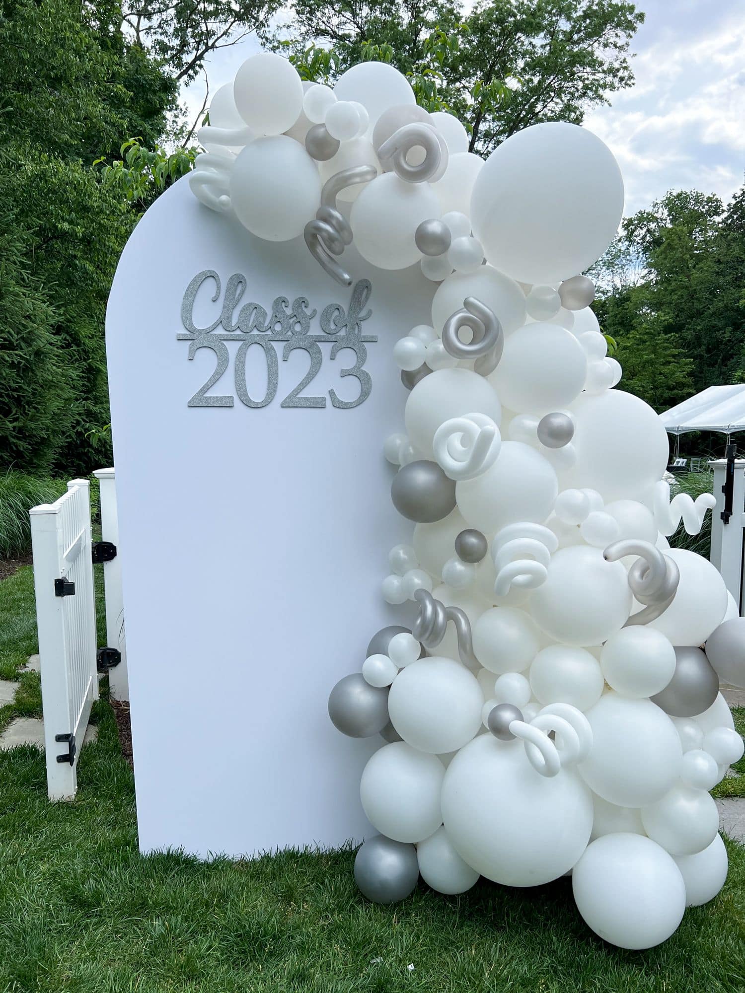 Organic Balloon Garland with Custom Sign and Chiara Arch for Graduation Party