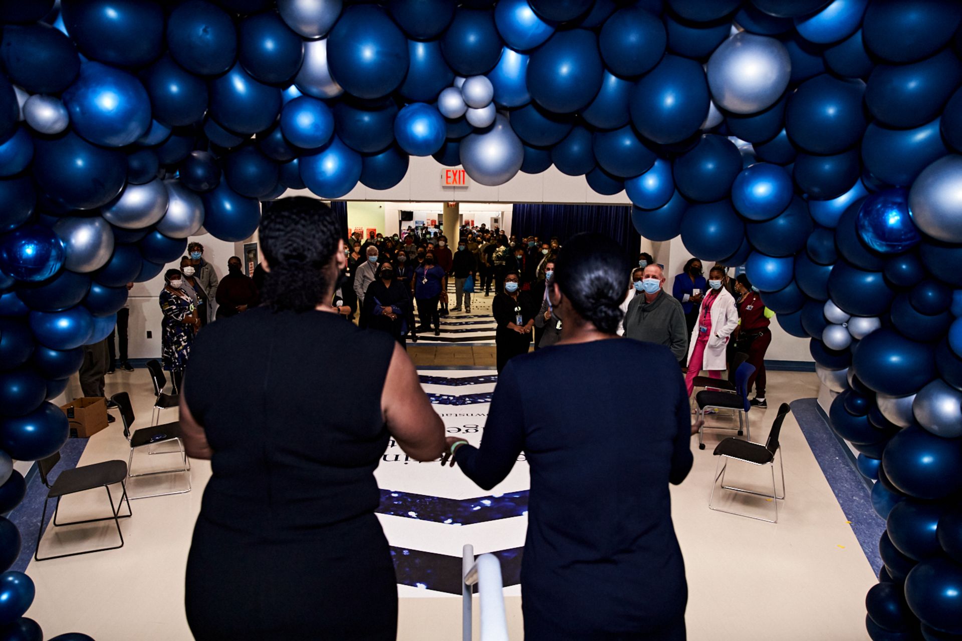 Fun Metallic Blue Balloon Tunnel around Stairs for Corporate Event