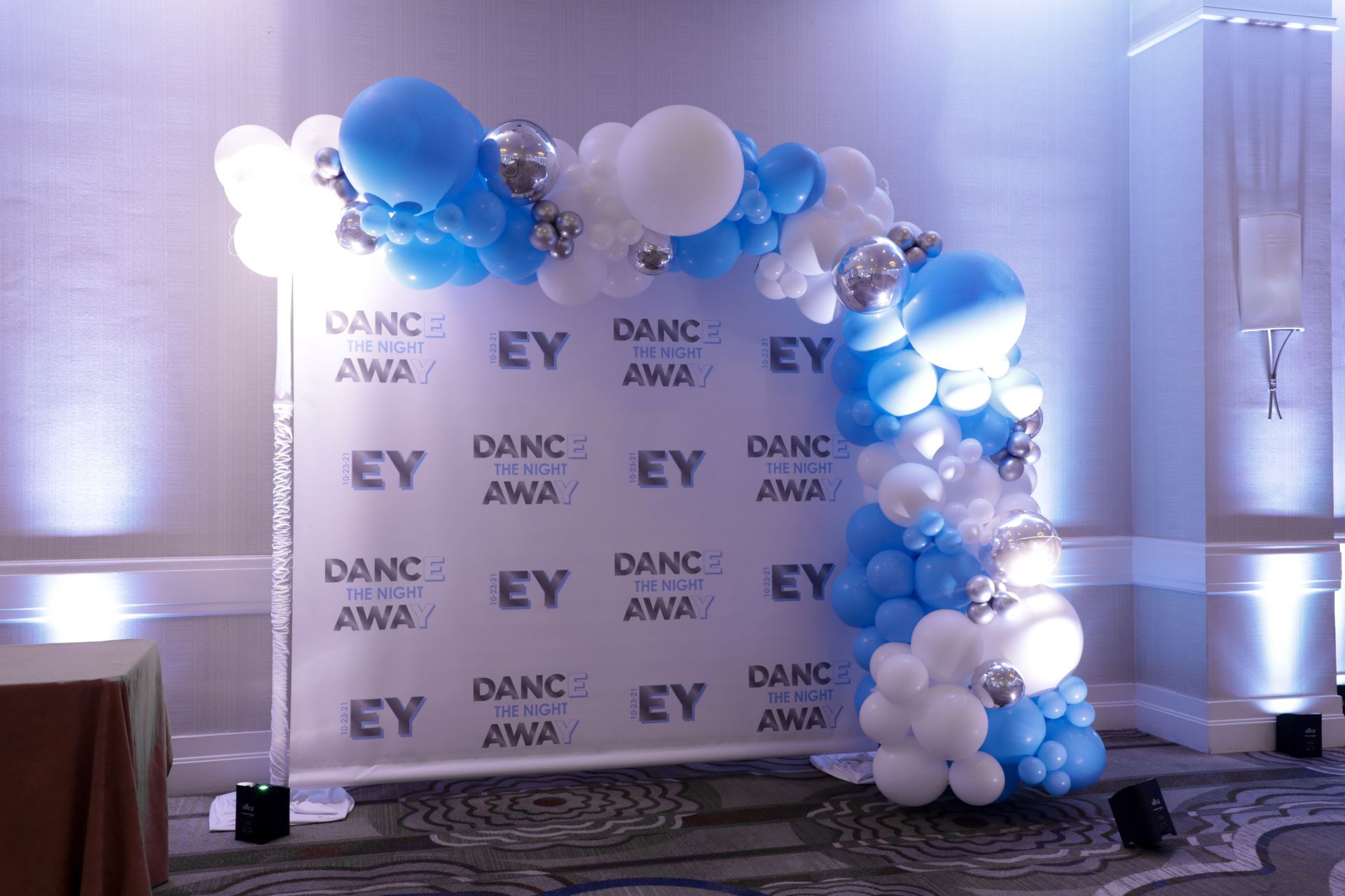 Beautiful Blue and White with Silver Accent Organic Half Balloon Arch over Step and Repeat as Photo Op for Bat Mitzvah Decor