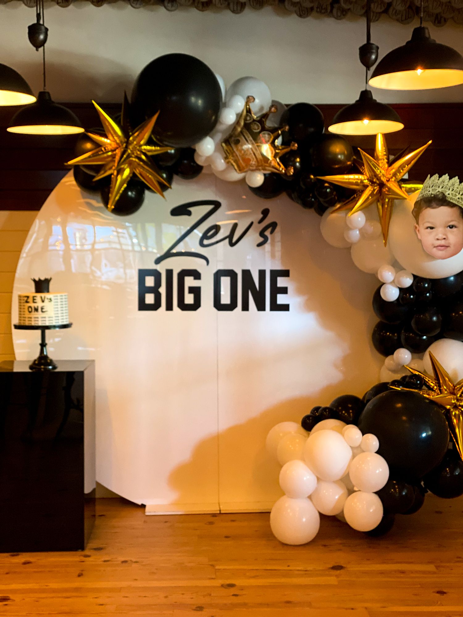 Organic Balloon Half Arch with Spiked Balloons and Custom Cut Out Over Acrylic Wall with Custom Sign