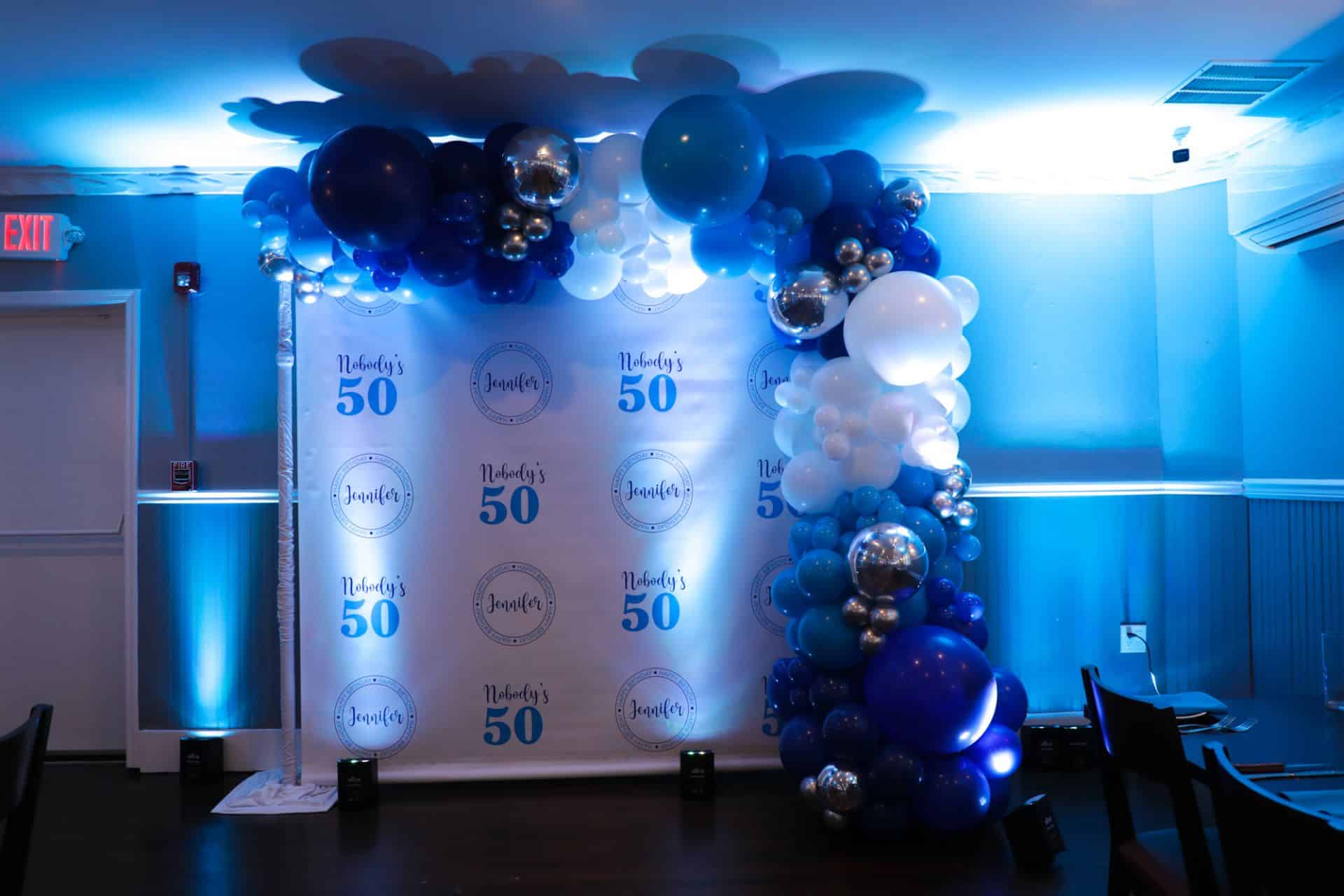 Organic Balloon Garland on Custom Step & Repeat for 50th Birthday