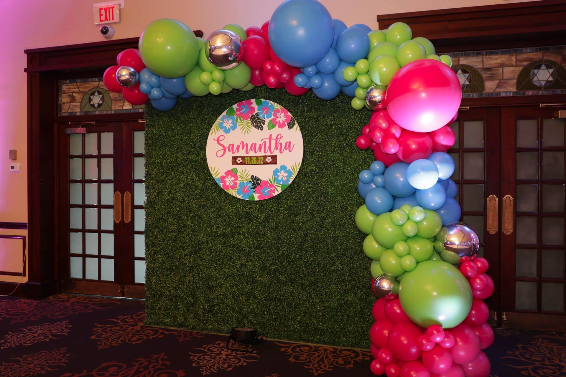 Tropical Balloon Garland with Greenery Wall and Custom Logo Sign for Bat Mitzvah at Temple Emanuel-el, Closter