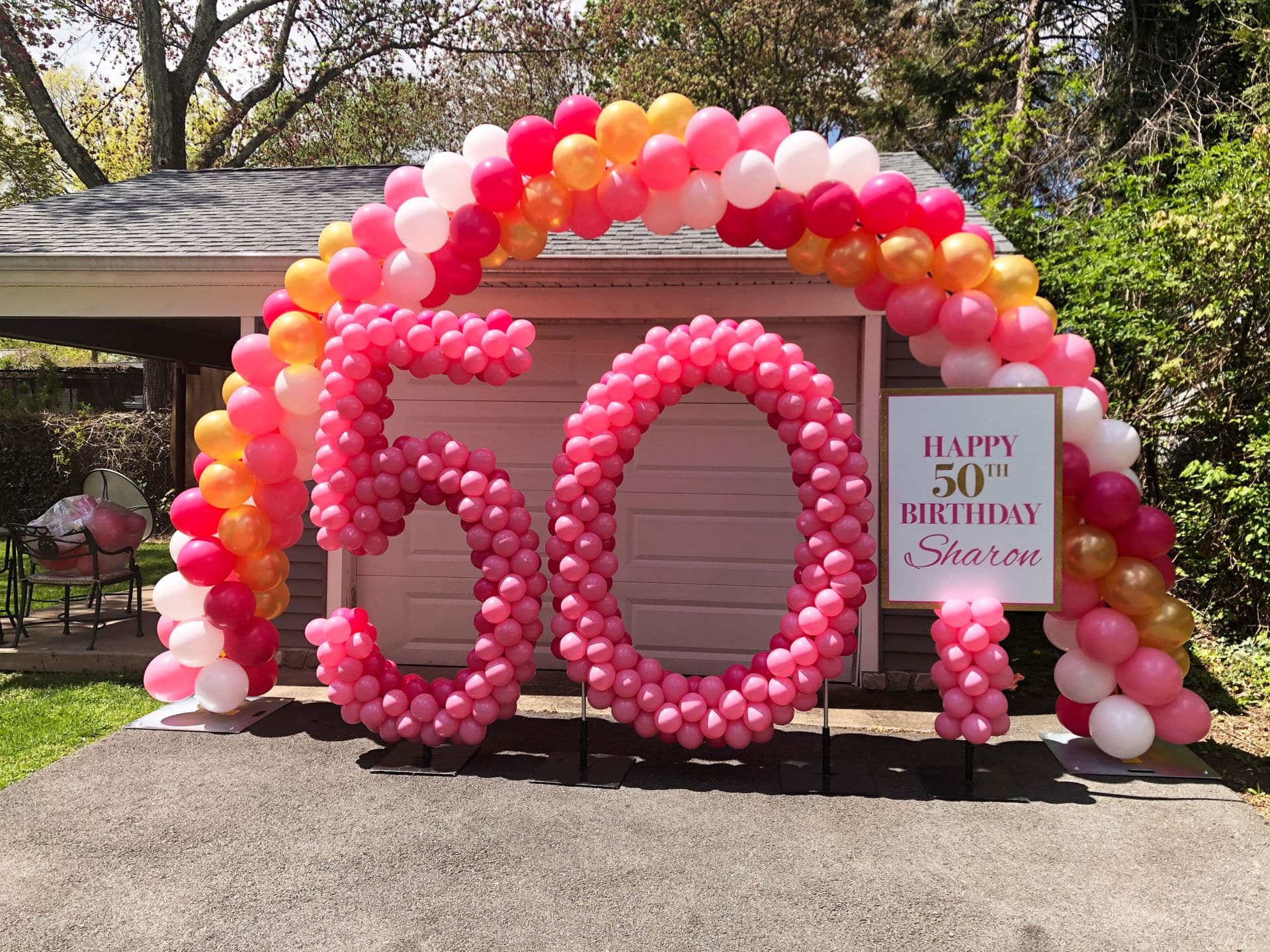 50th Balloon Arch with Sculpture Numbers and Custom Sign