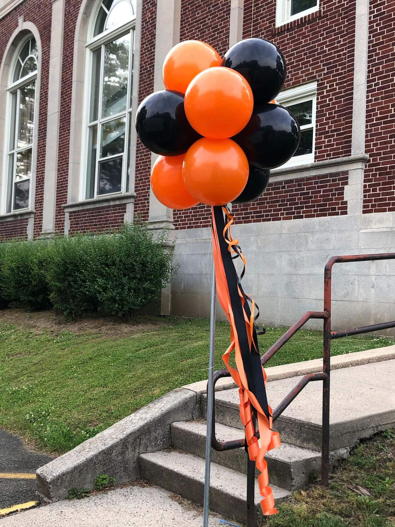 Black and Orange Balloon Topiary for Outdoor Event