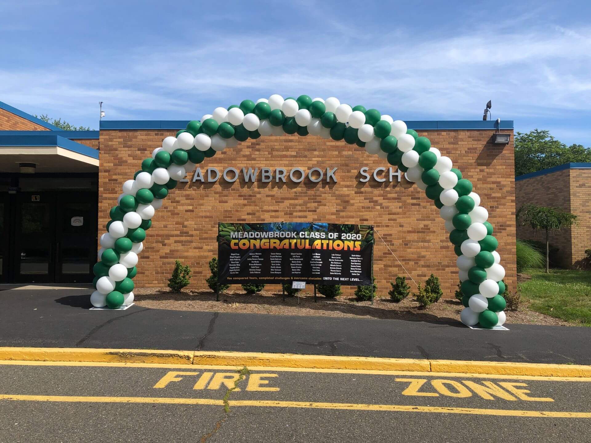 Green and White Balloon Arch for Drive By Graduation Outdoors