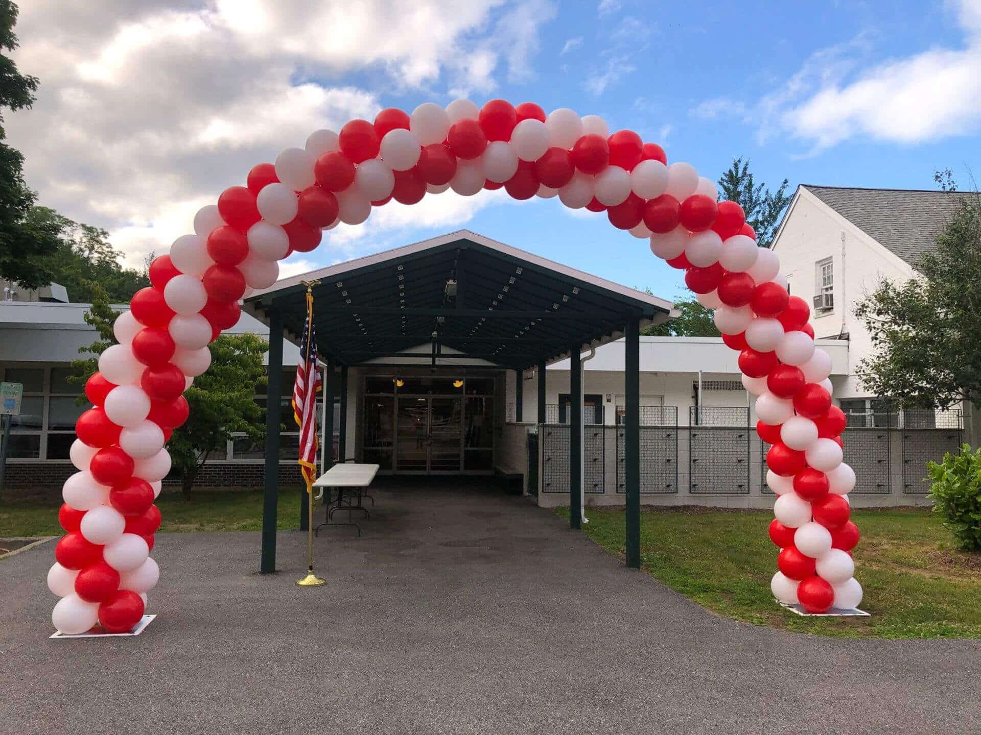 Red and White Balloon Arch for Outdoor Graduation Drive By