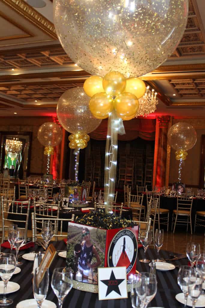 Red Carpet Themed Photo Cube with Gold Sparkle Balloons and Lights