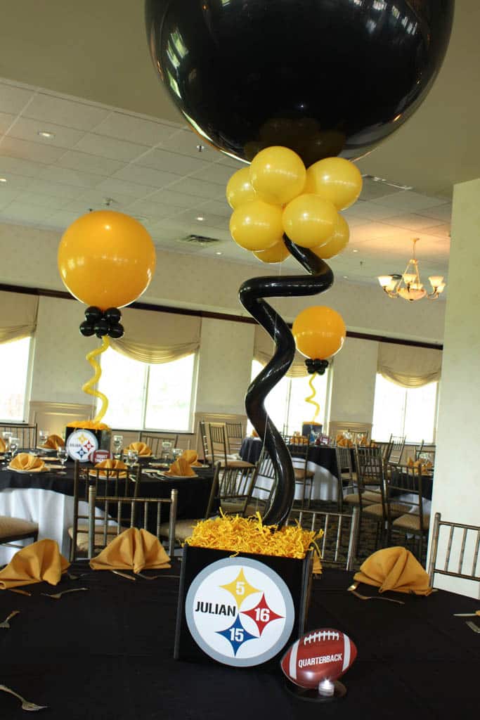 Steelers Cube Centerpieces with Alternating Black and Yellow Balloons