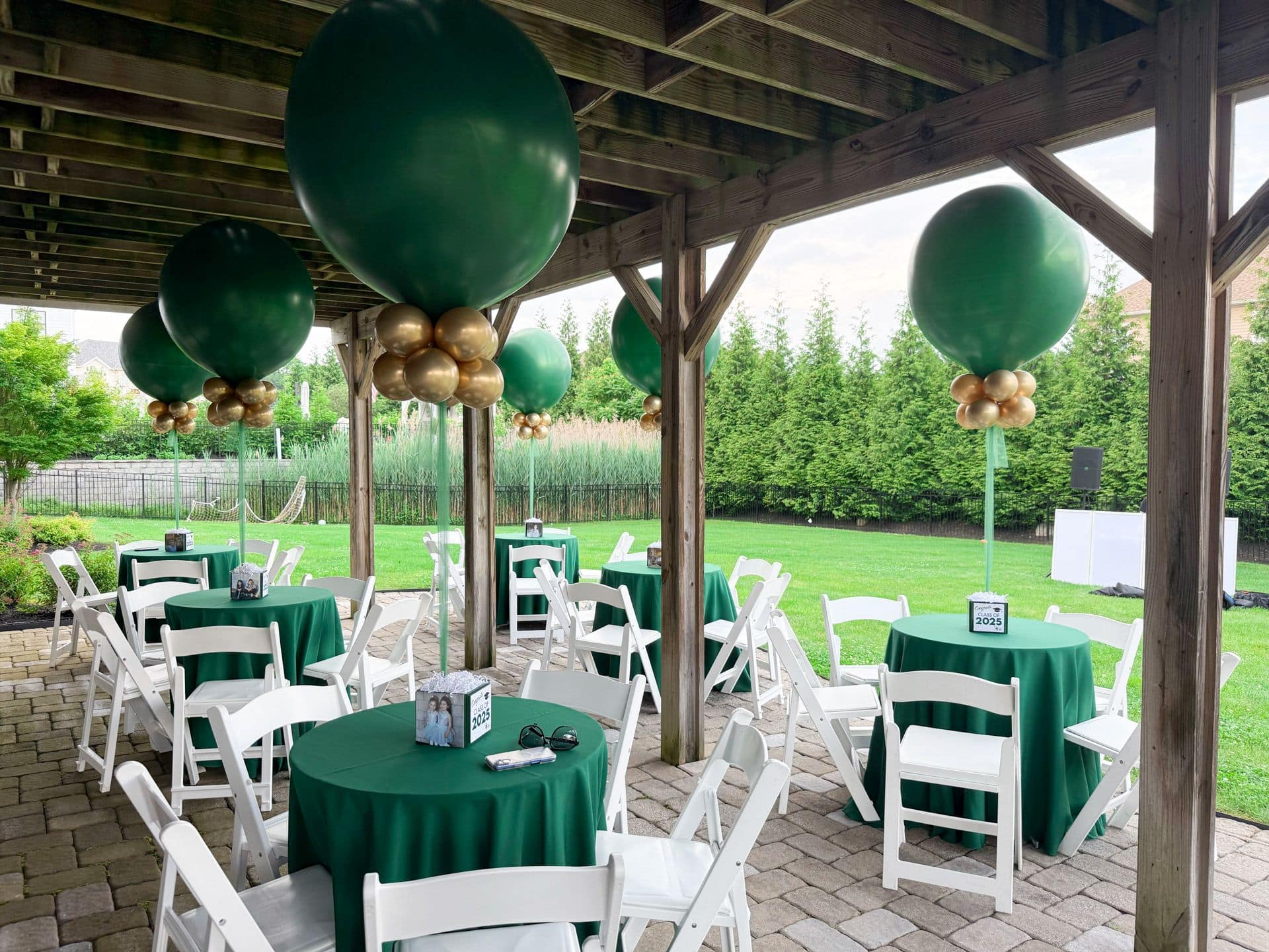 Green and Gold Balloon Centerpieces for Outdoor Graduation